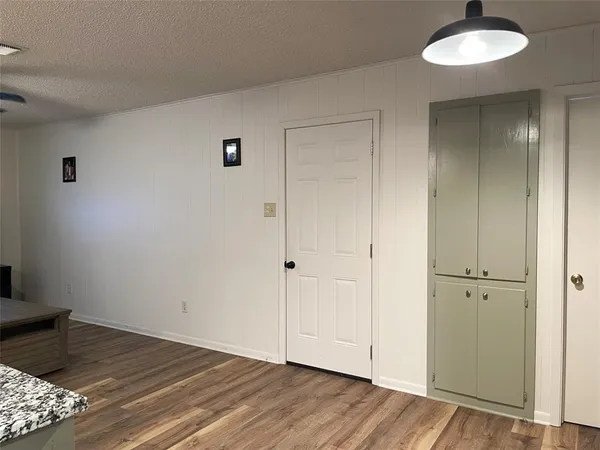 a view of a livingroom with wooden floor