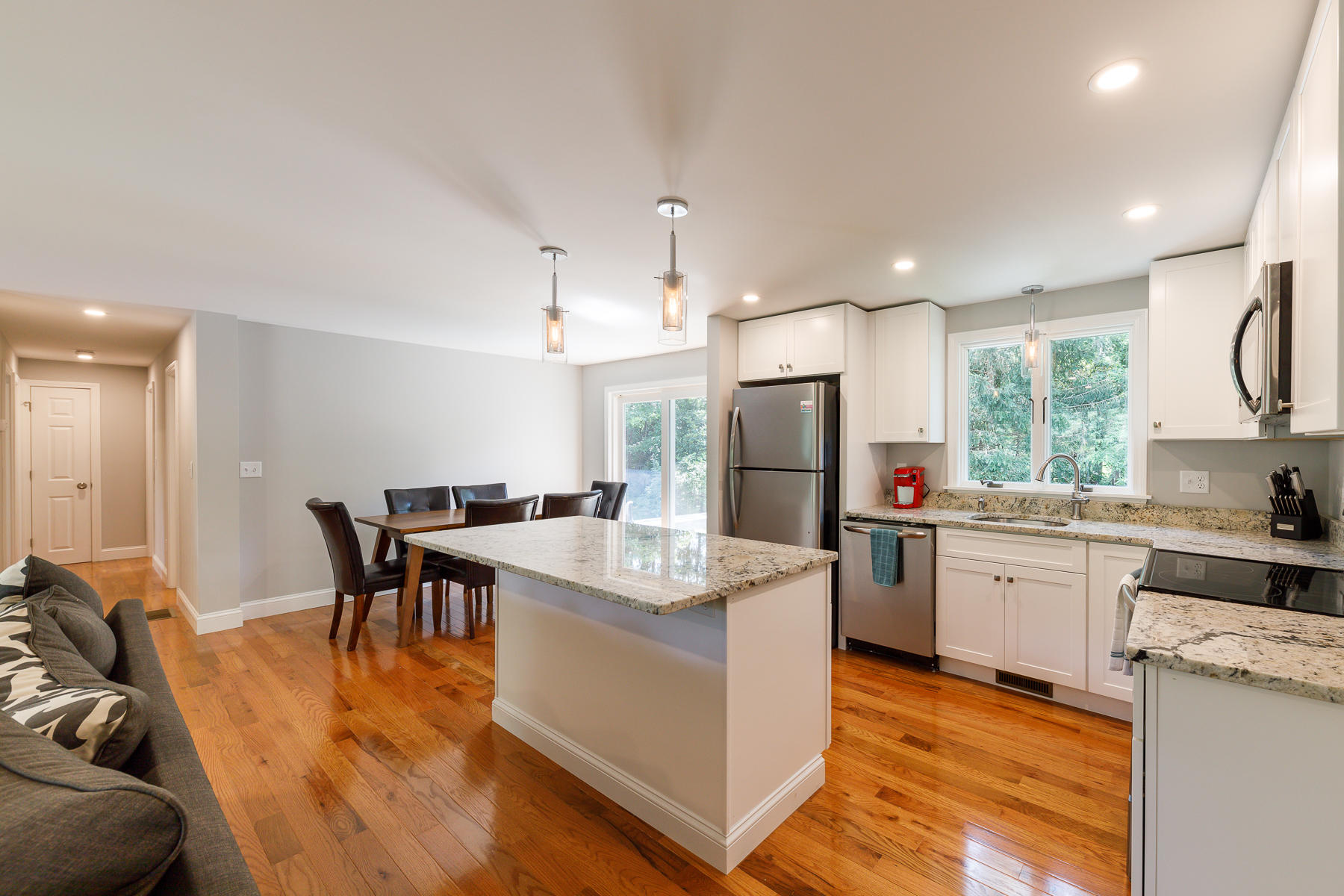 3 Rivers End Road East Falmouth, MA 02536 - Photo 15 of 38 a large kitchen with kitchen island a sink table and chairs