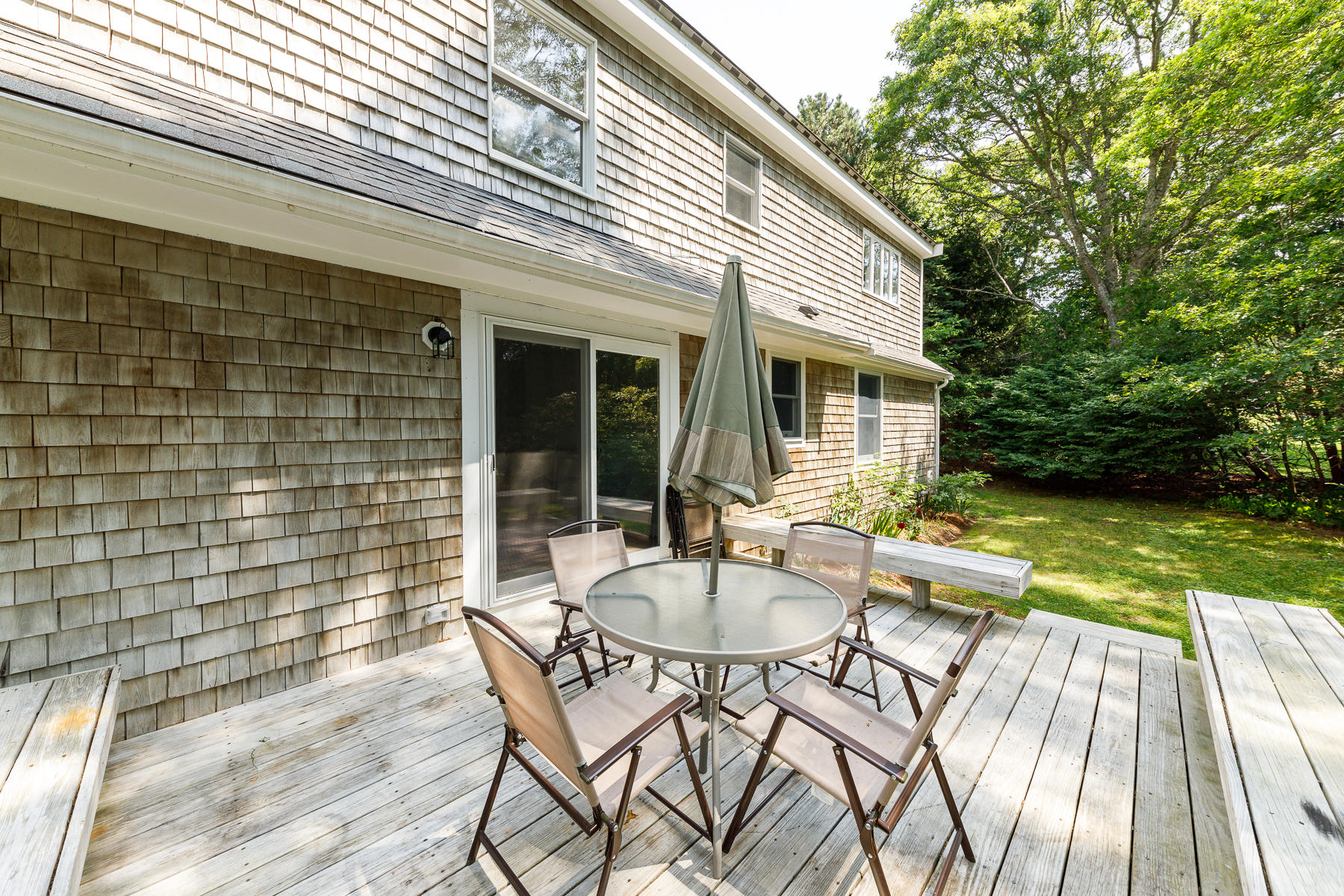 3 Rivers End Road East Falmouth, MA 02536 - Photo 3 of 38 a view of a patio with table and chairs and floor to ceiling window