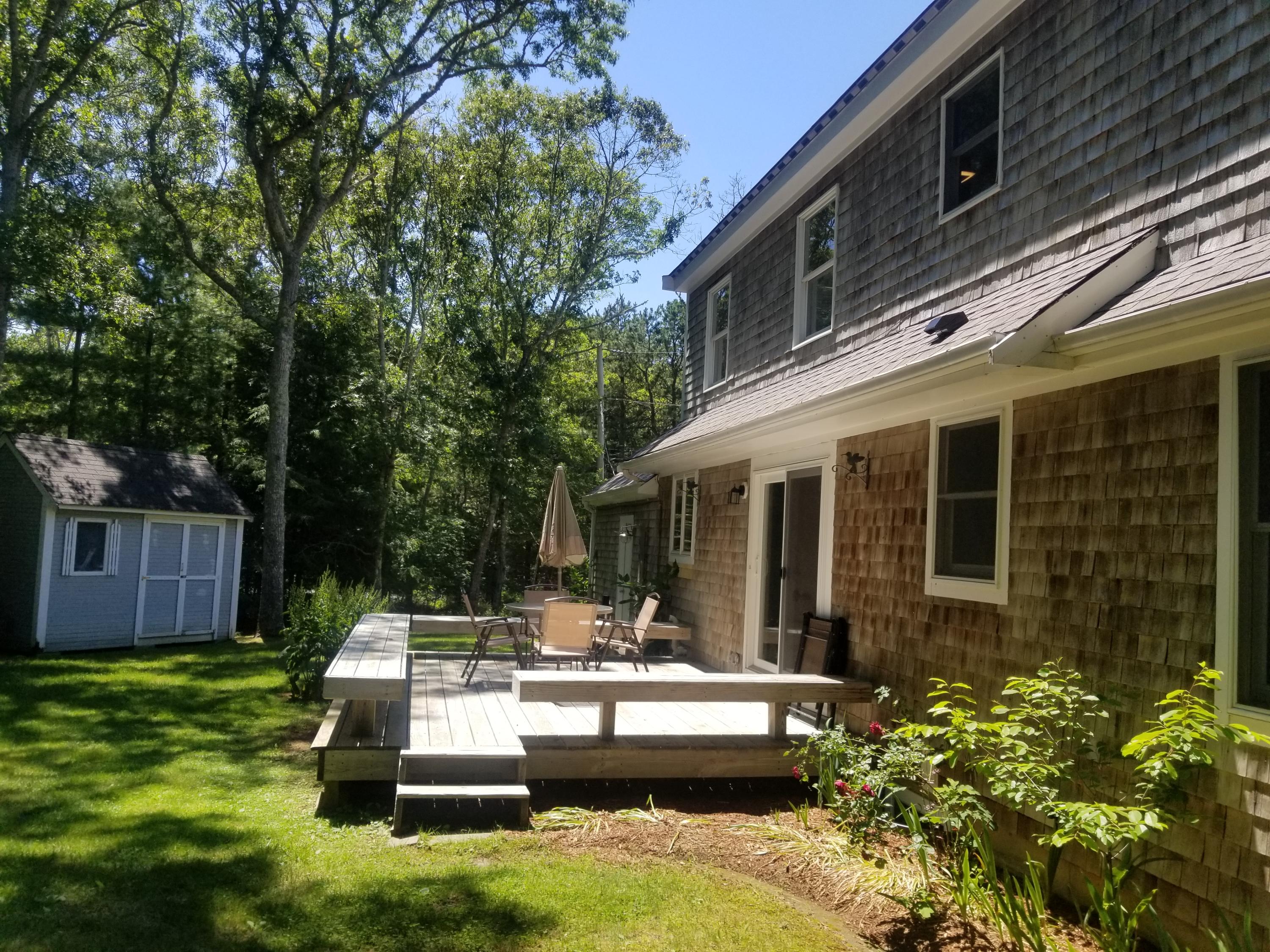 3 Rivers End Road East Falmouth, MA 02536 - Photo 5 of 38 a view of a house with backyard sitting area and garden