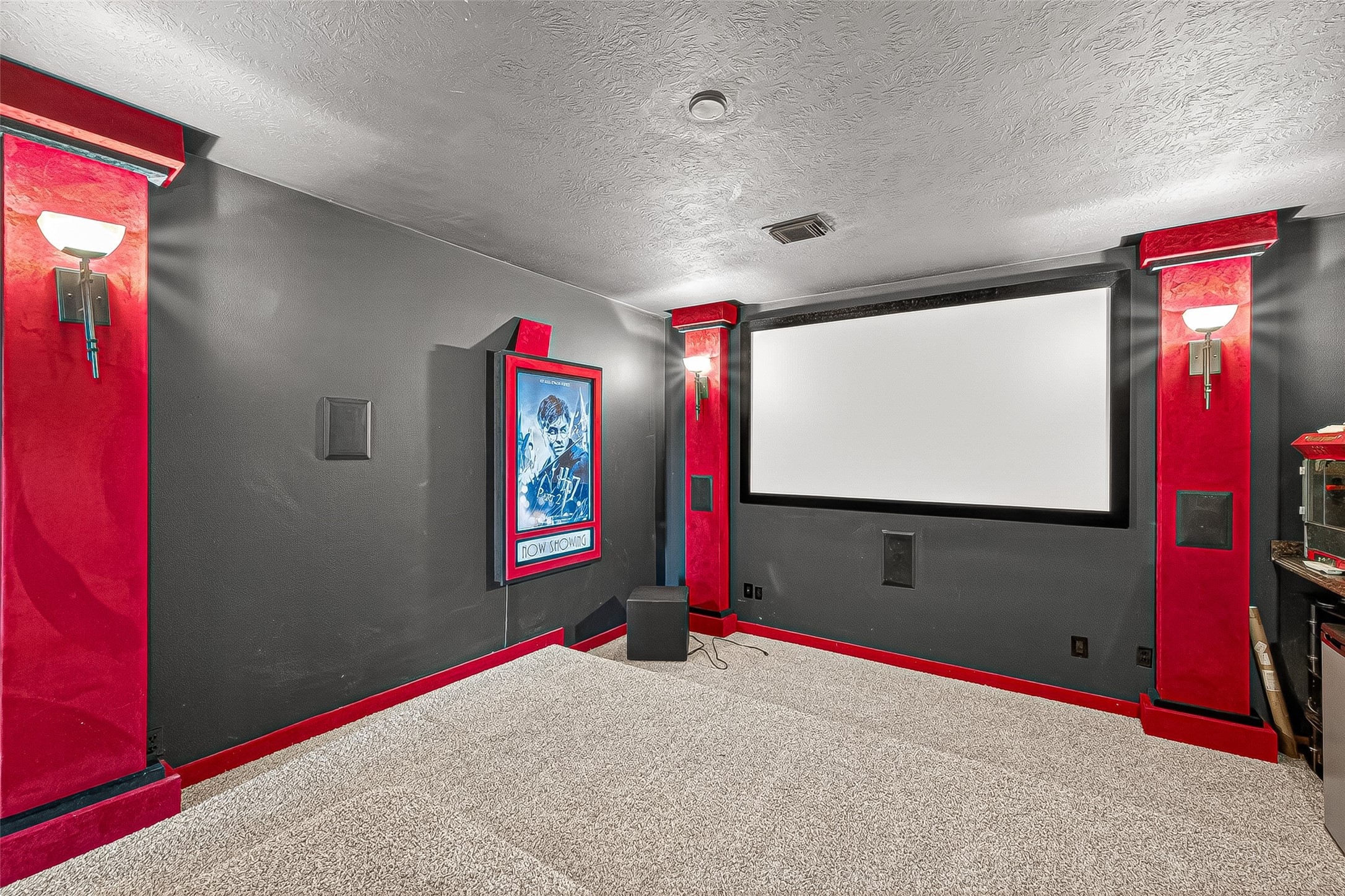 25626 Windy Isle Court Spring, TX 77389 - Photo 29 of 45 Further down the hallway, towards the front, this cozy in-home theater room will be ideal to curl up on the couch for movie nights.