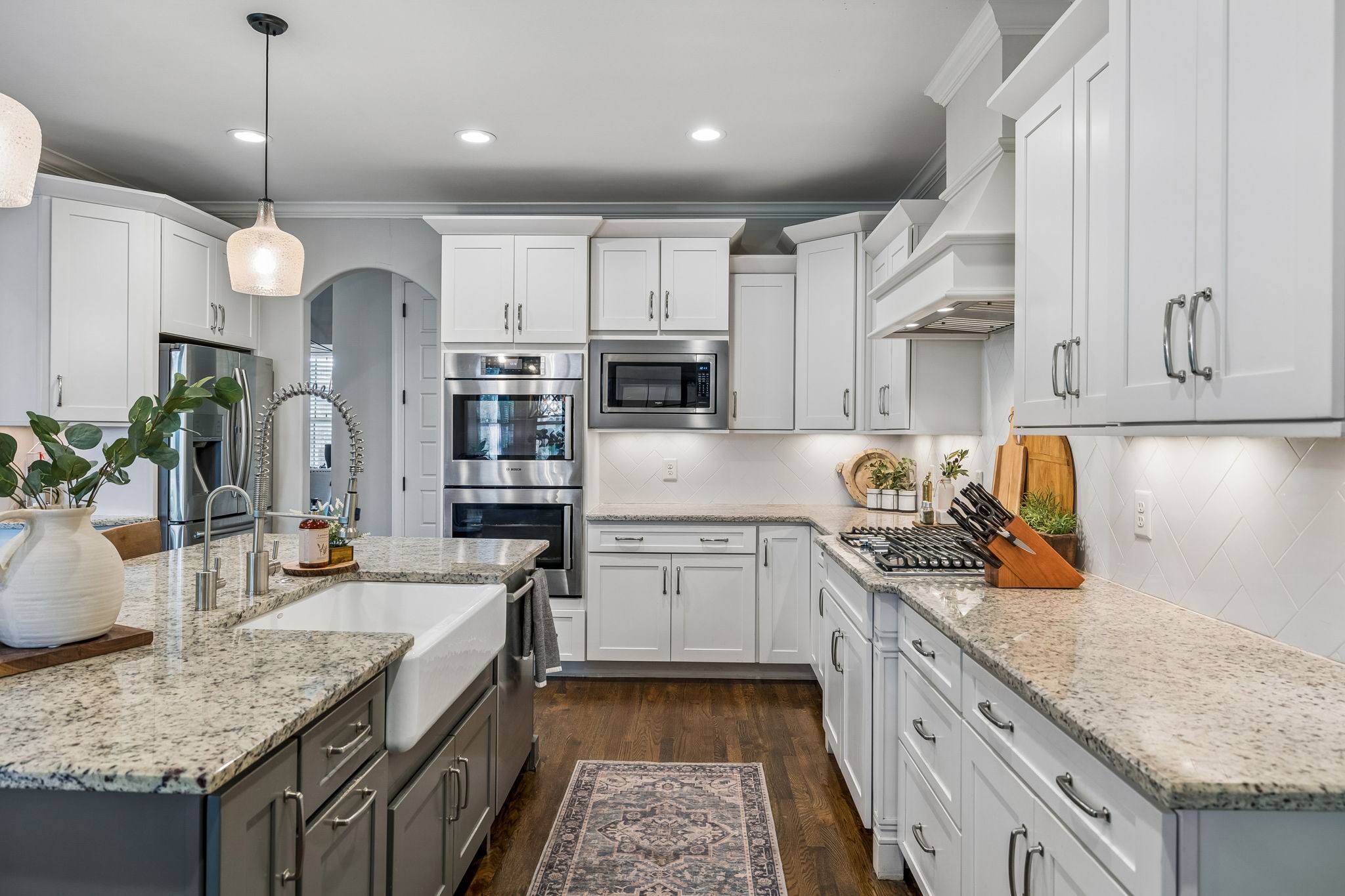 4035 Old Light Circle Arrington, TN 37014 - Photo 23 of 62 a kitchen with stainless steel appliances granite countertop a sink stove and refrigerator