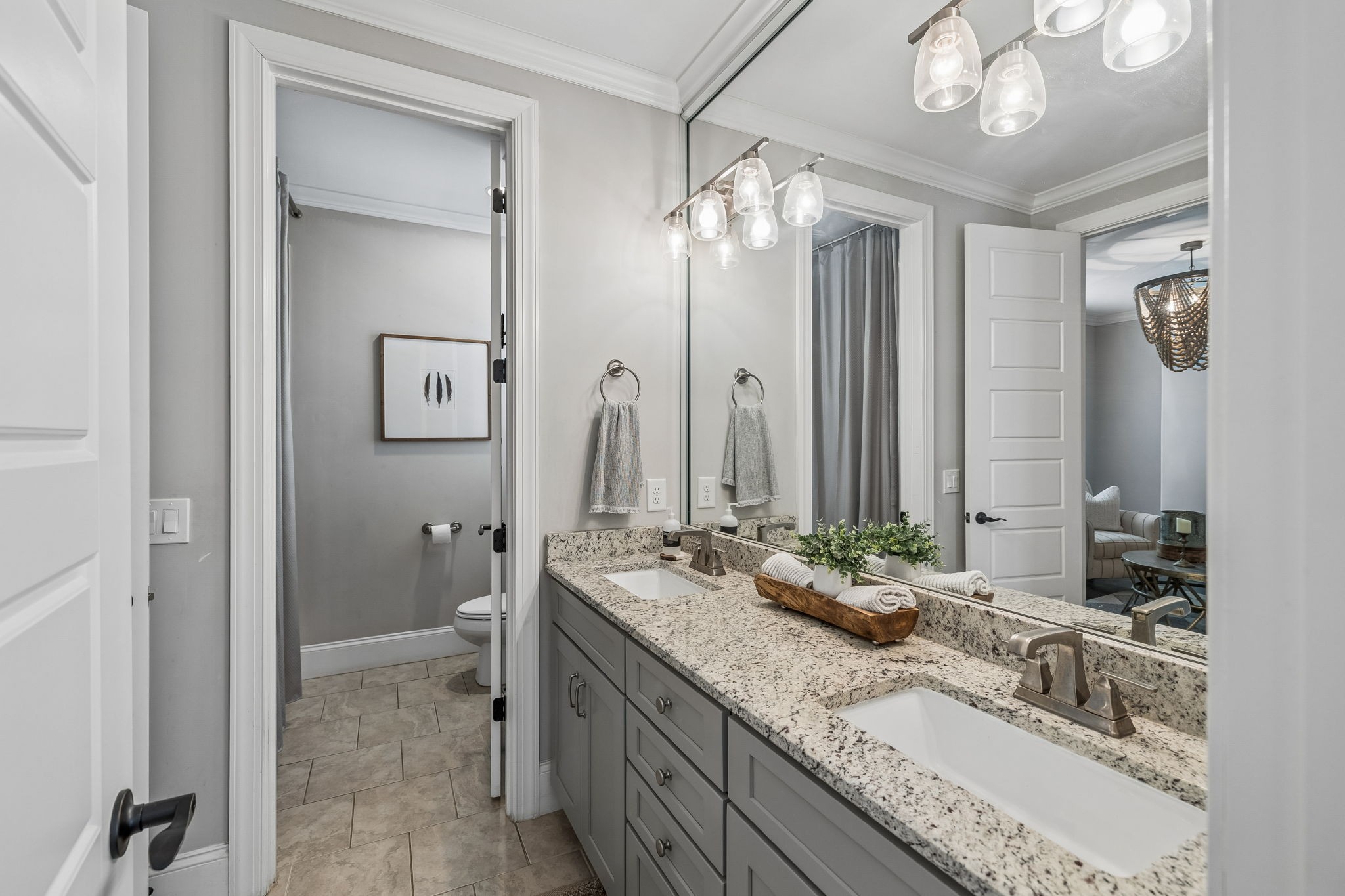 4035 Old Light Circle Arrington, TN 37014 - Photo 31 of 62 a bathroom with double vanity sinks a vanity a mirror and a shower