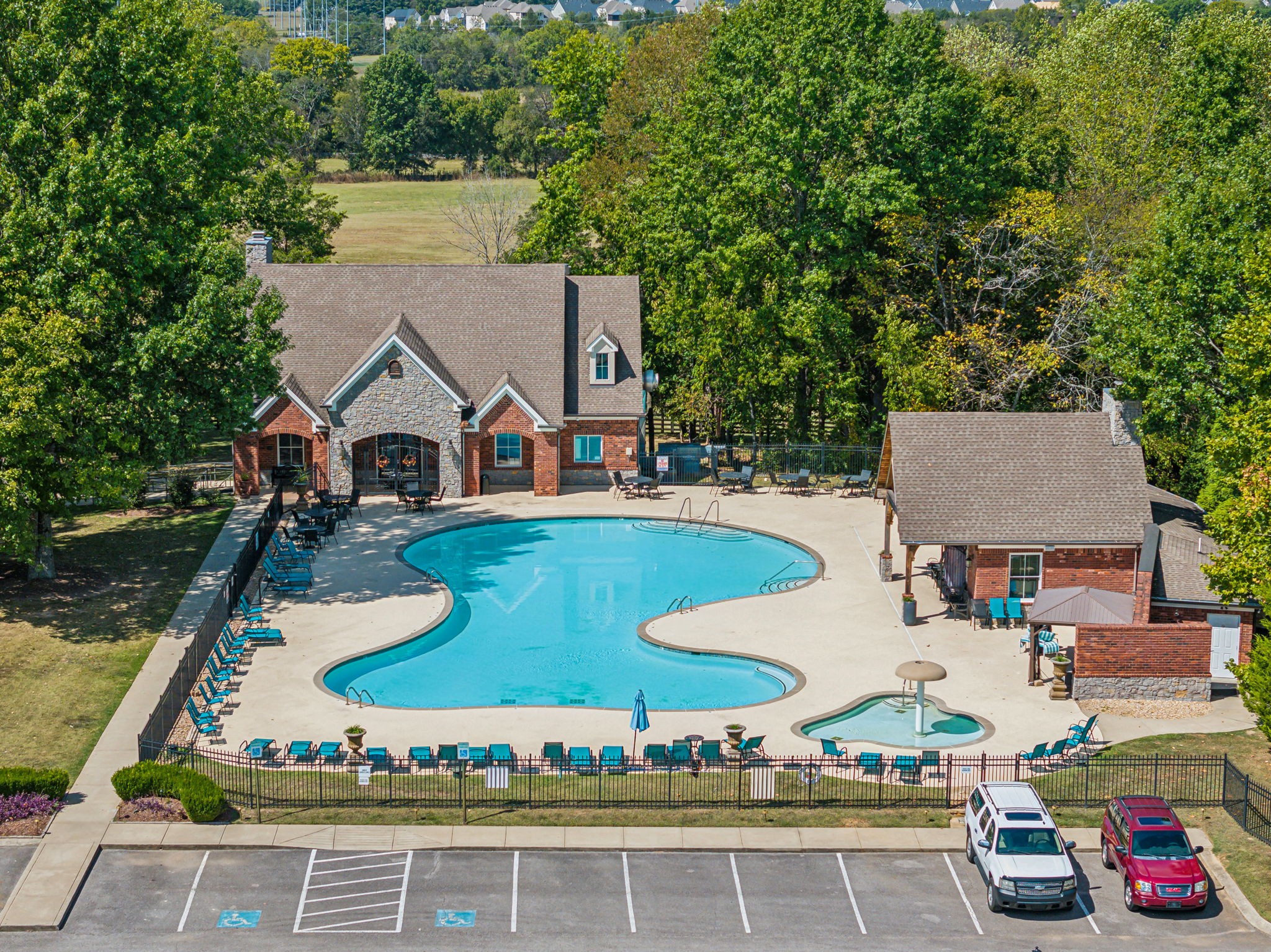 4035 Old Light Circle Arrington, TN 37014 - Photo 58 of 62 an aerial view of a house with swimming pool and large trees
