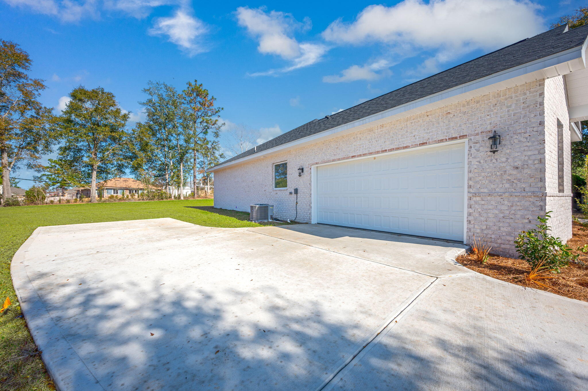 107 Winchester Way Crestview, FL 32539 - Photo 3 of 46 a view of a house with a yard and garage