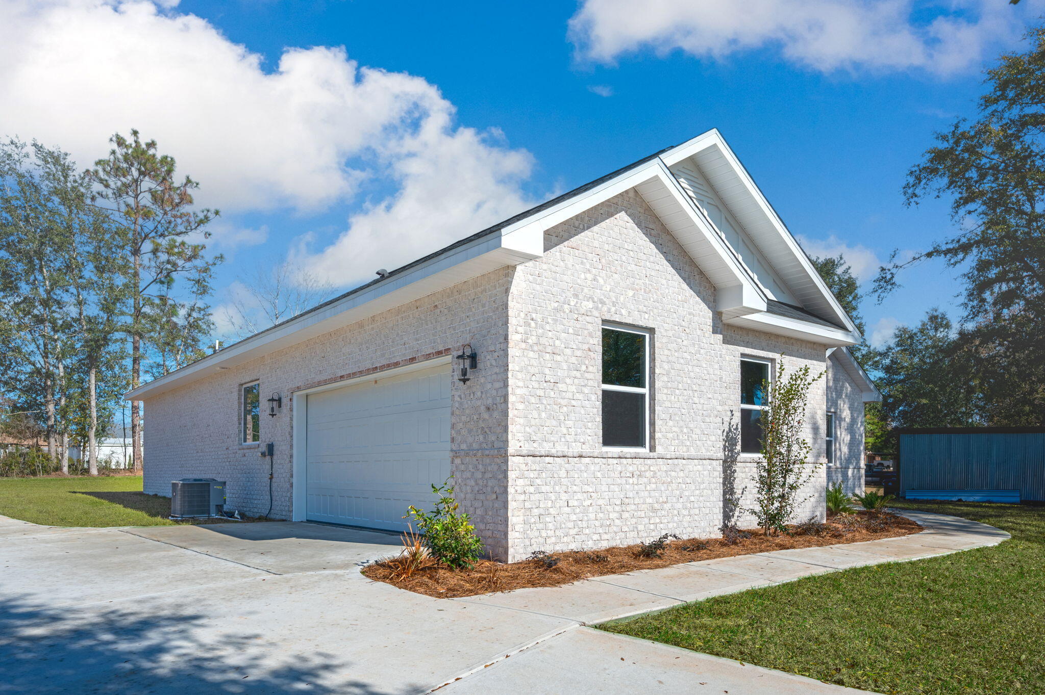107 Winchester Way Crestview, FL 32539 - Photo 4 of 46 a front view of a house with a yard and garage