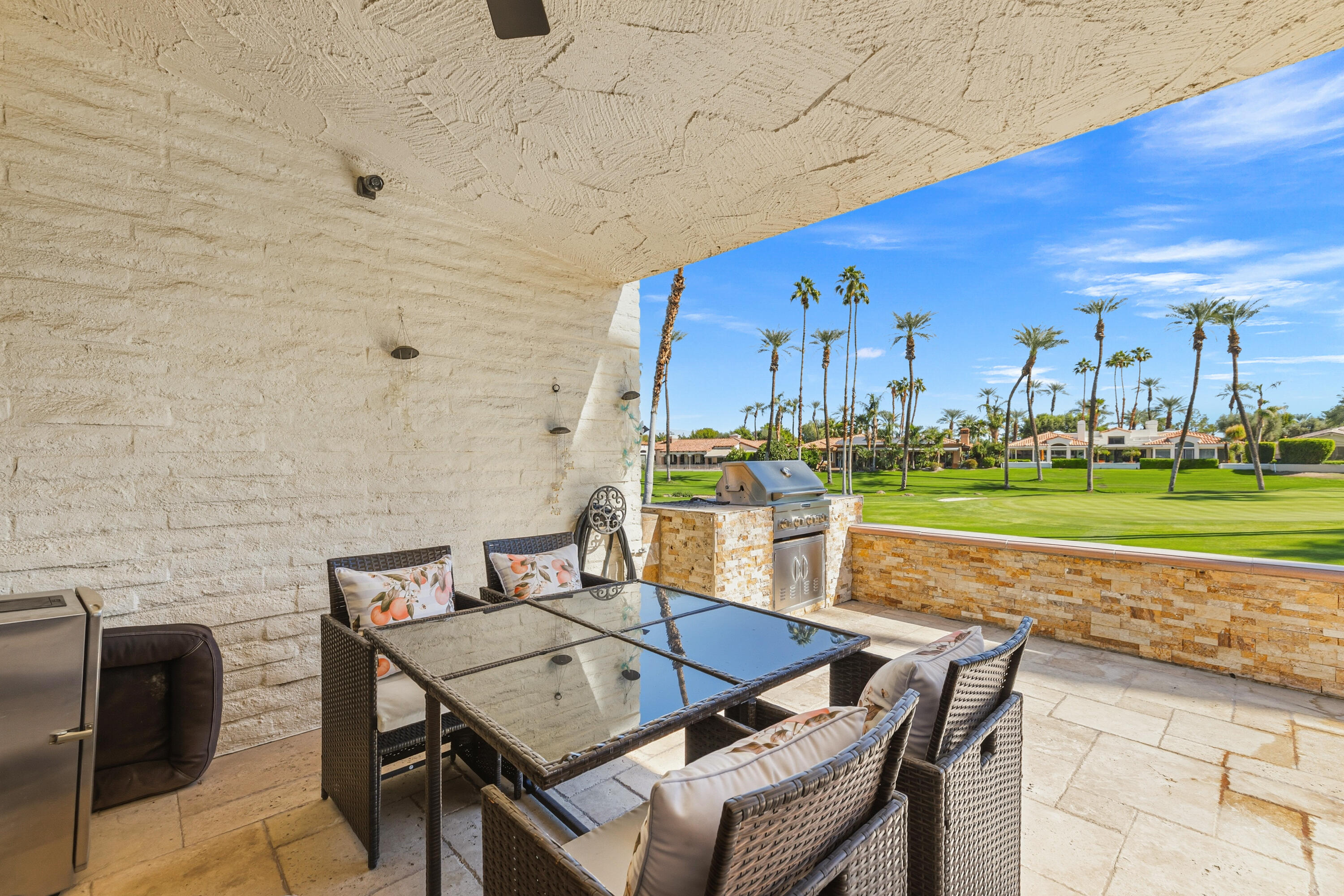 44828 Oro Grande Circle Indian Wells, CA 92210 - Photo 22 of 59 a view of a terrace with furniture