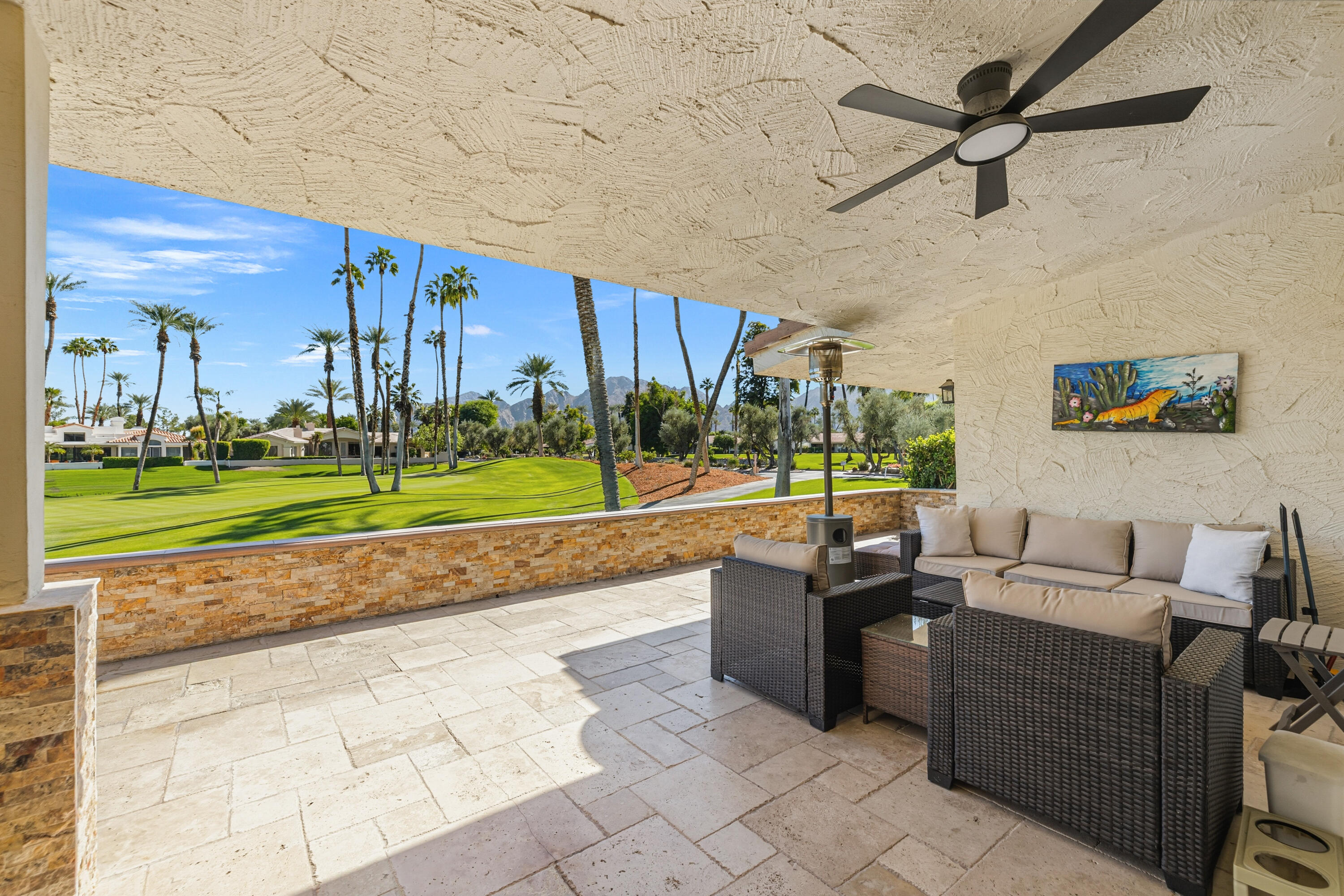 44828 Oro Grande Circle Indian Wells, CA 92210 - Photo 23 of 59 a living room with couch and a garden