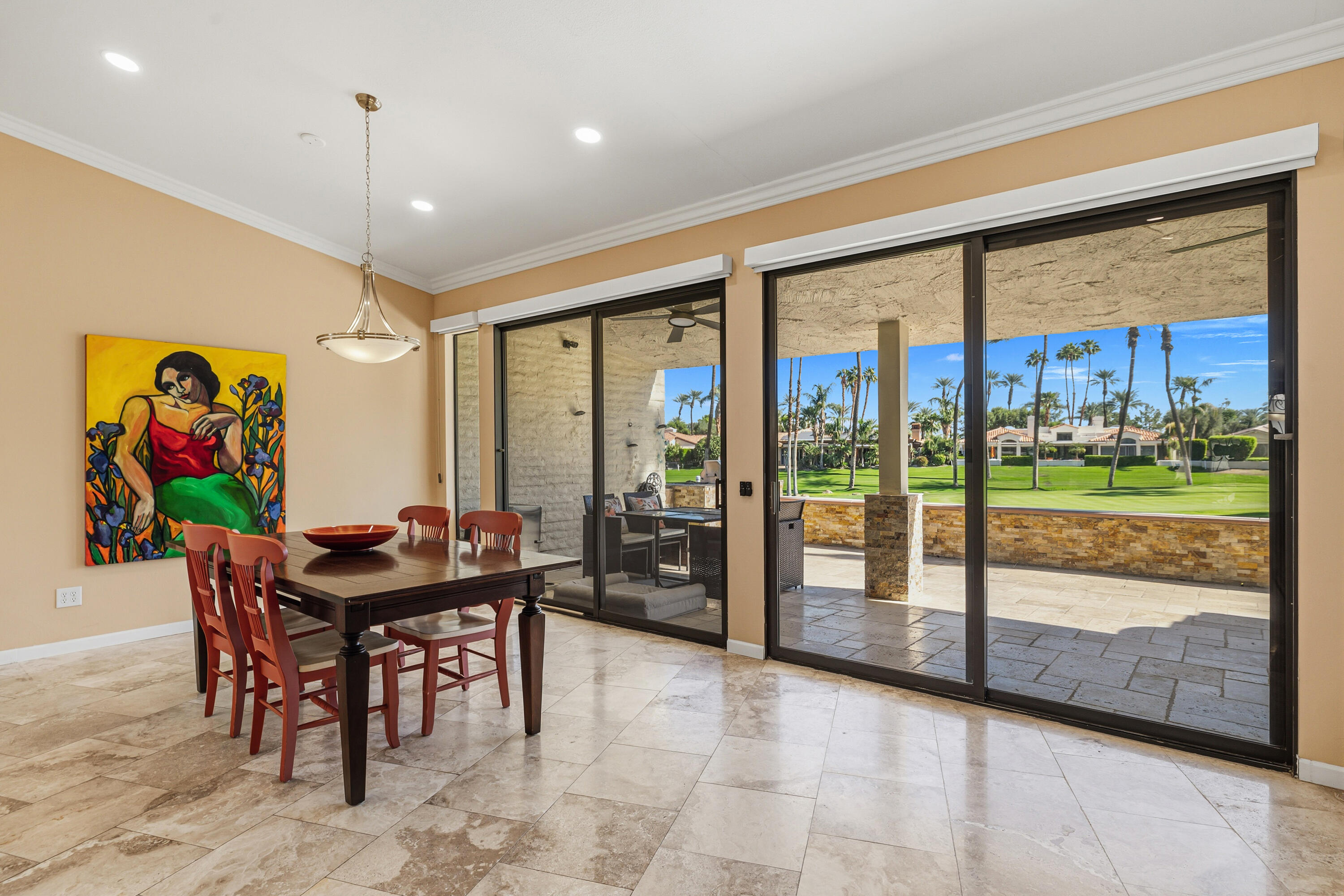 44828 Oro Grande Circle Indian Wells, CA 92210 - Photo 26 of 59 a dining room with furniture a floor to ceiling window and a rug