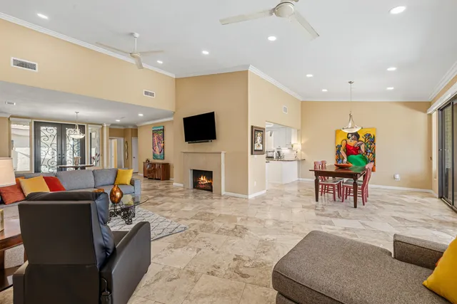 a living room with furniture and a table