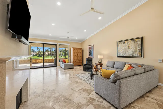 a kitchen with a stove a sink and chairs