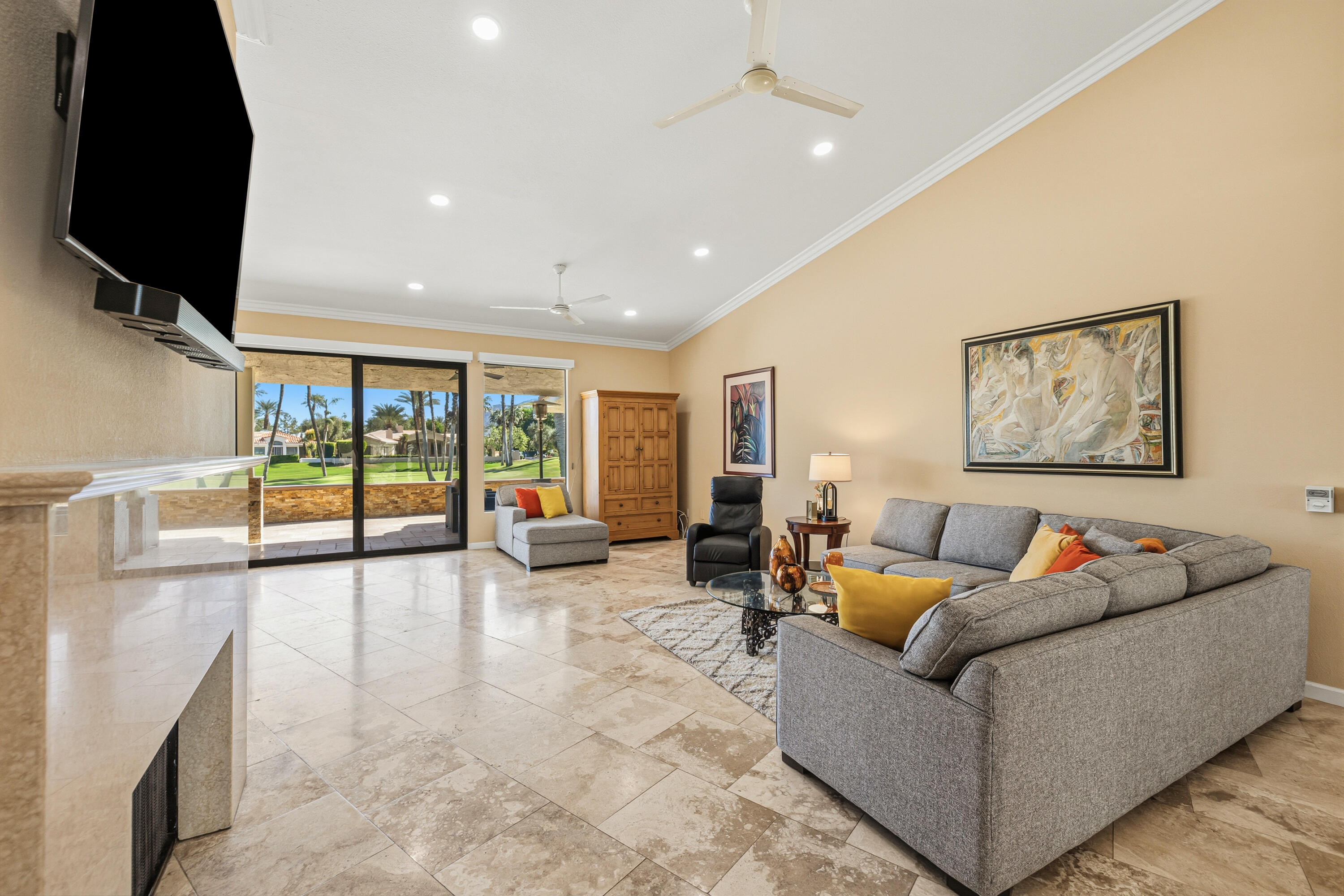 44828 Oro Grande Circle Indian Wells, CA 92210 - Photo 29 of 59 a living room with furniture and a flat screen tv
