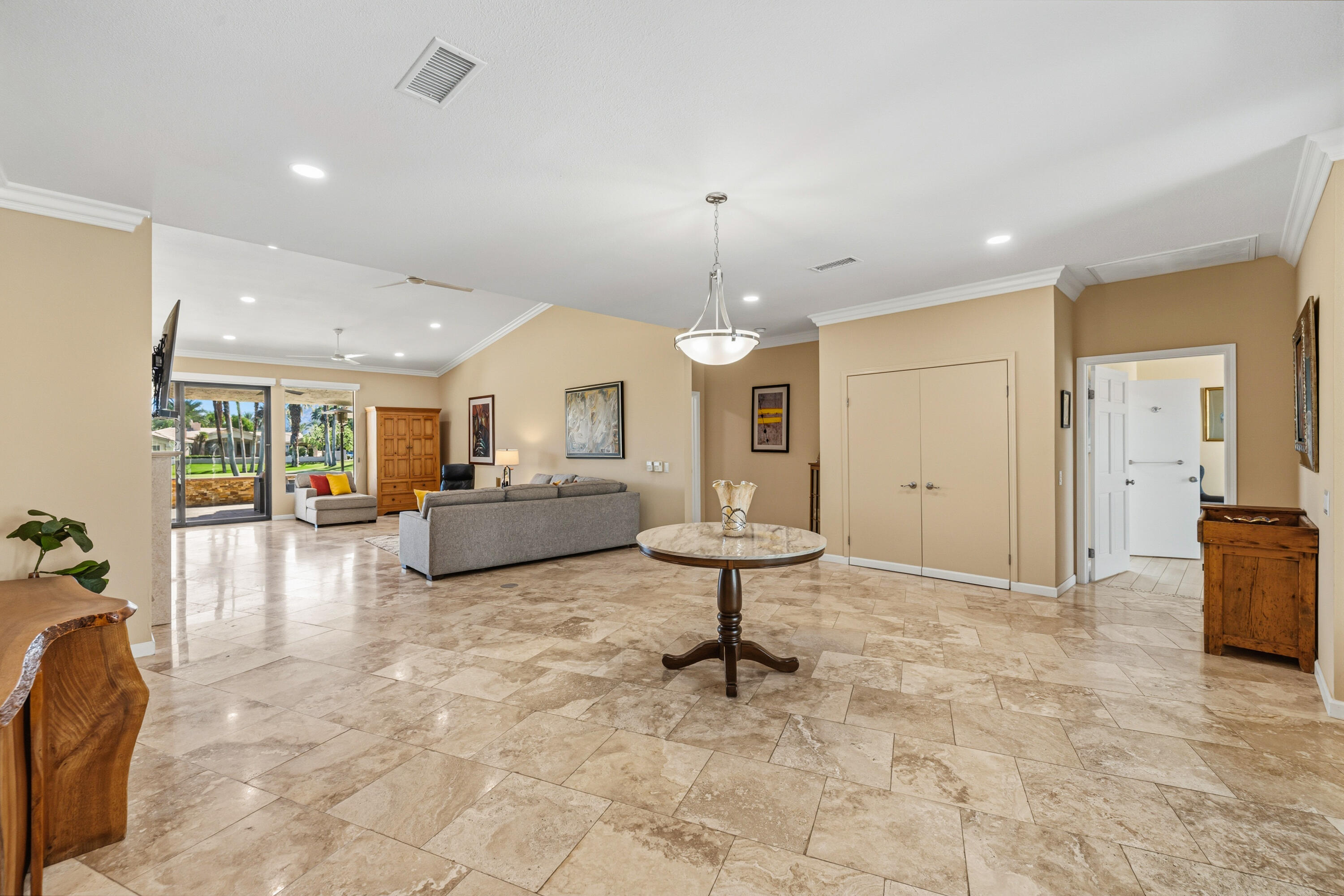 44828 Oro Grande Circle Indian Wells, CA 92210 - Photo 34 of 59 a living room with furniture and a table