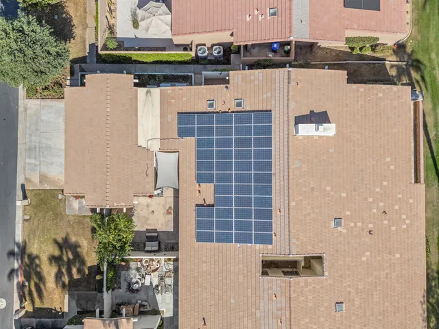 a view of a patio with a table and chairs