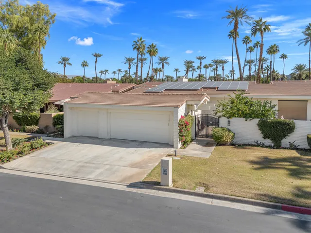 a view of a house with basketball court