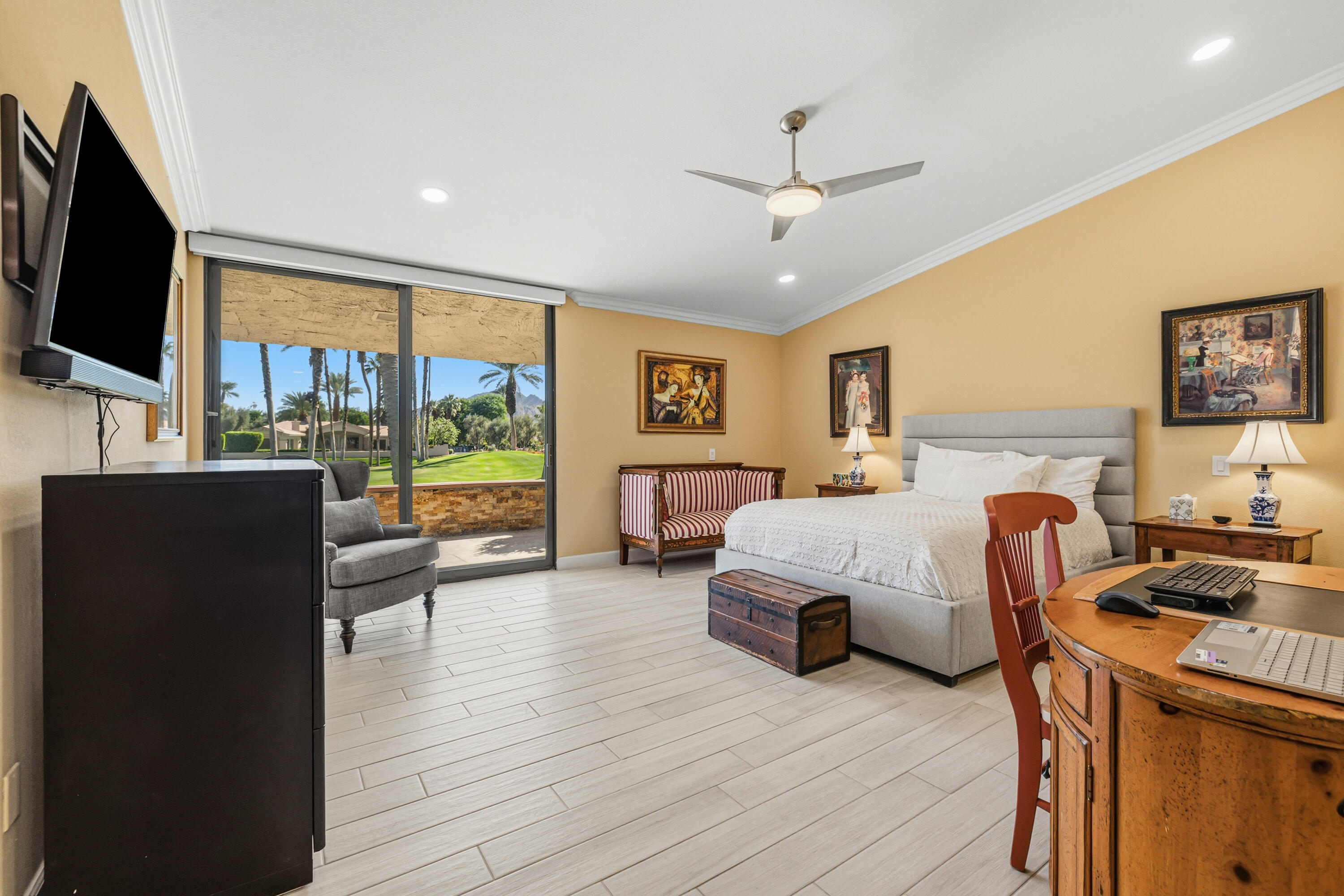 44828 Oro Grande Circle Indian Wells, CA 92210 - Photo 51 of 59 a bedroom with a bed and large flat screen tv