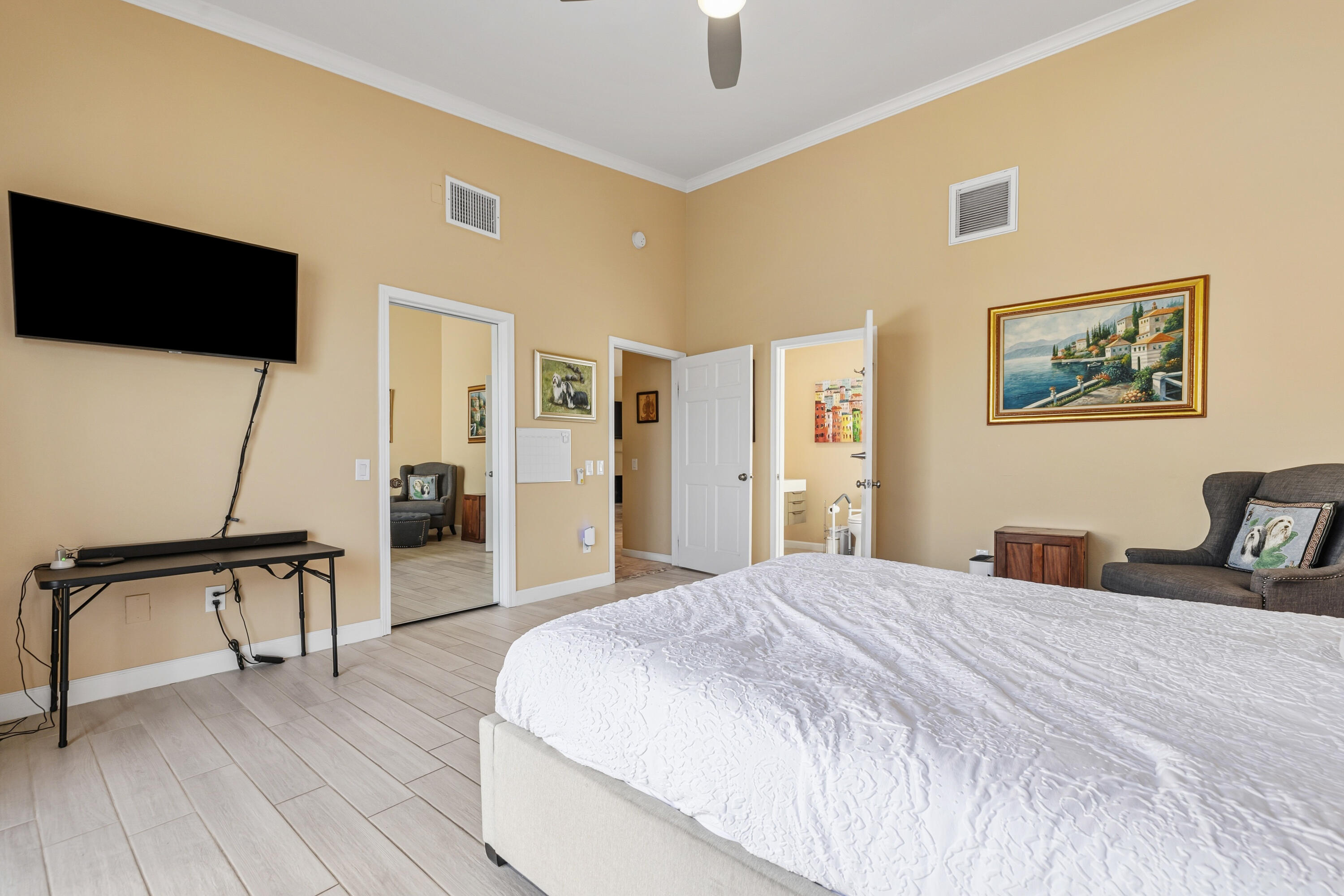 44828 Oro Grande Circle Indian Wells, CA 92210 - Photo 52 of 59 a bedroom with a bed and a flat screen tv