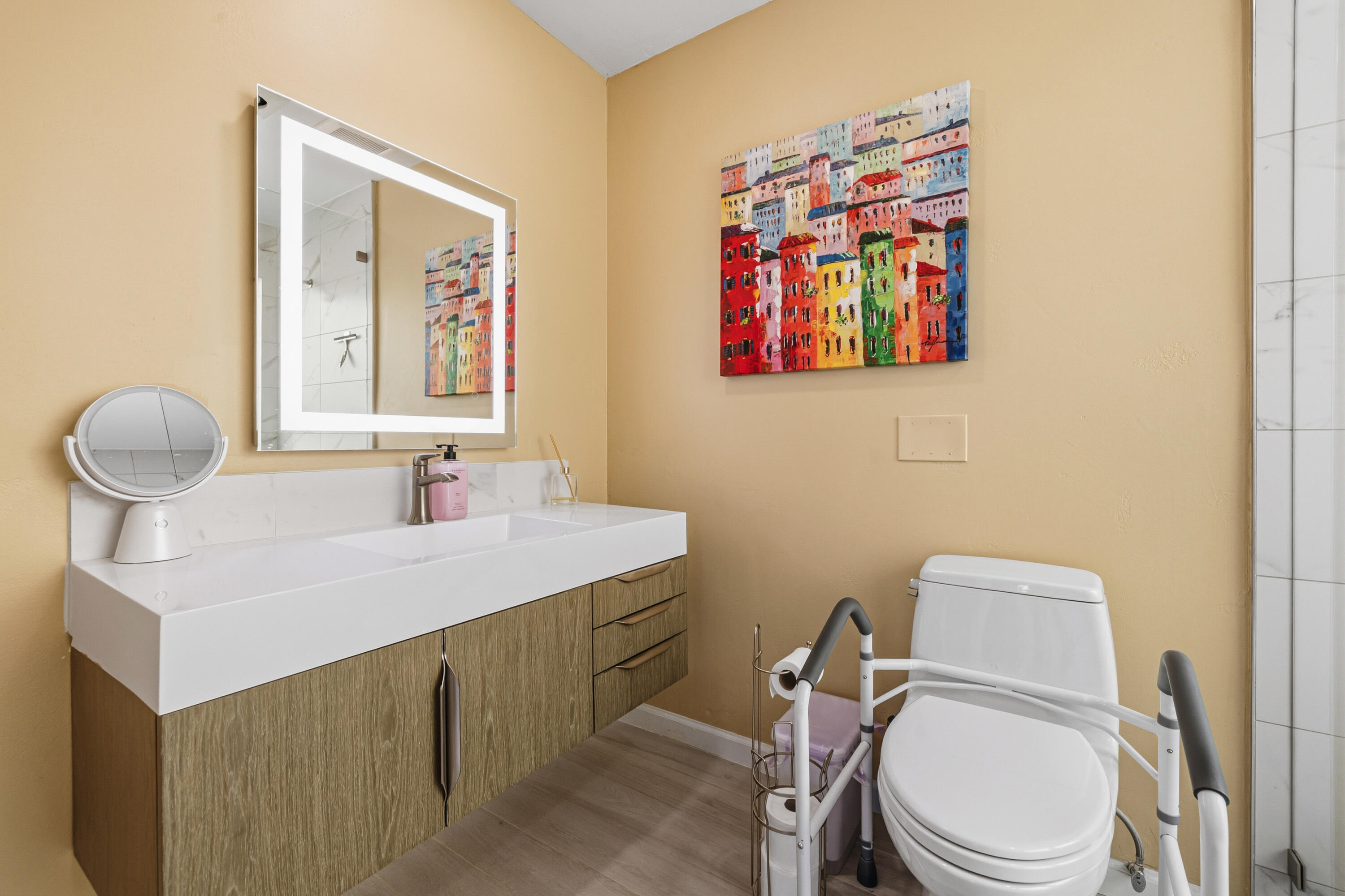 44828 Oro Grande Circle Indian Wells, CA 92210 - Photo 53 of 59 a bathroom with a toilet sink and mirror