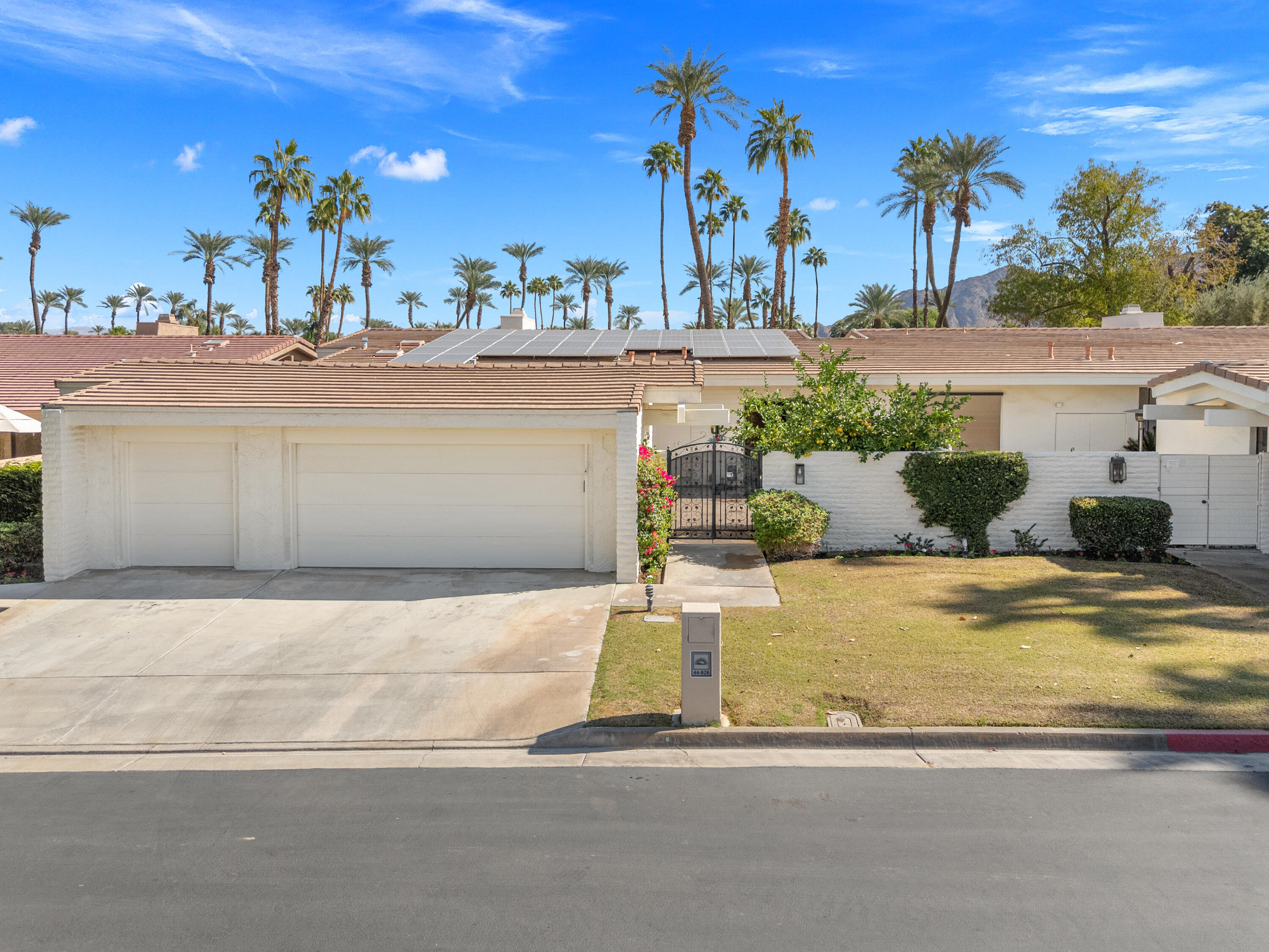 44828 Oro Grande Circle Indian Wells, CA 92210 - Photo 7 of 59 a view of a house with basketball court
