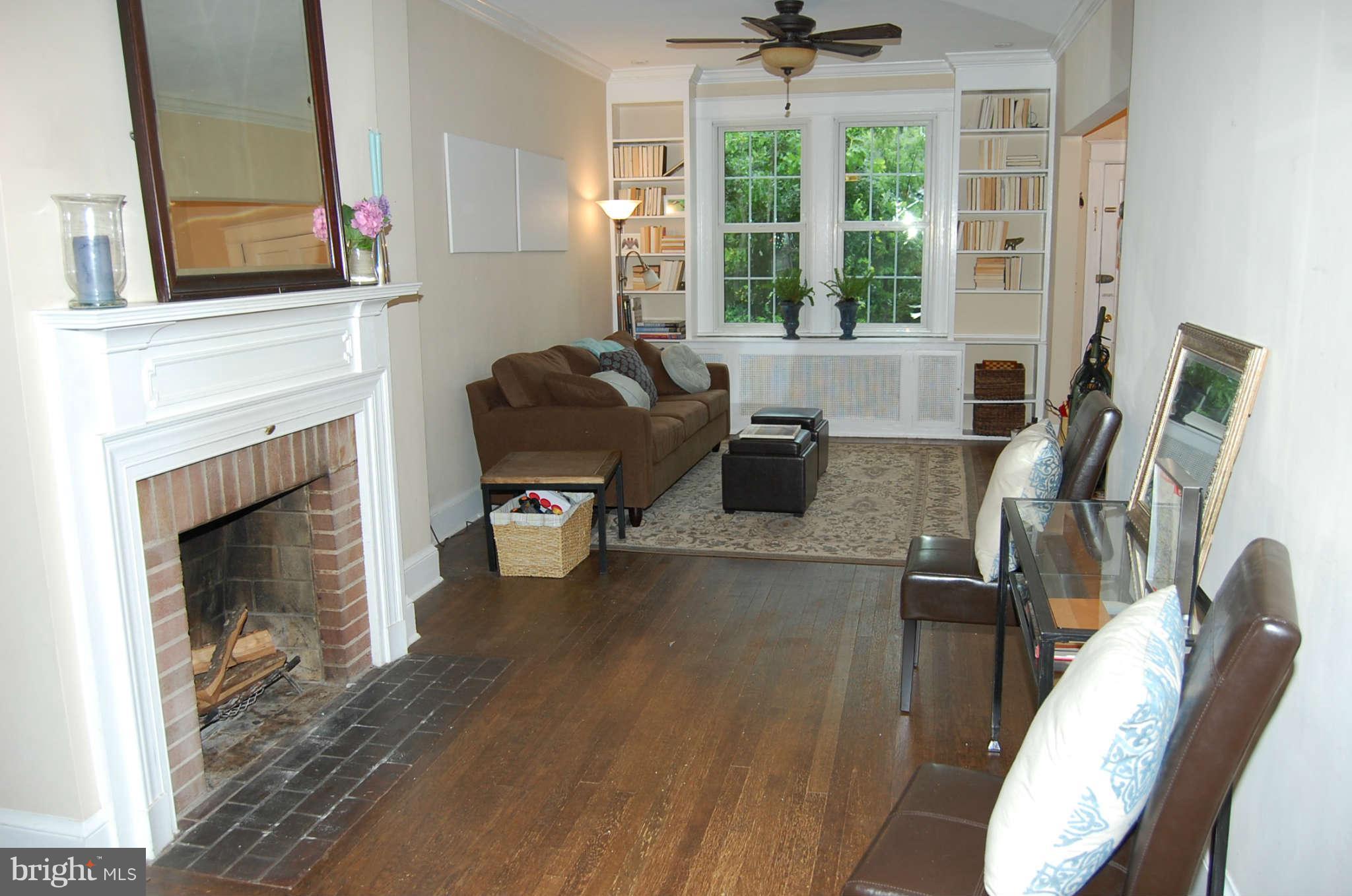 2403 Tunlaw Road Northwest Washington, DC 20007 - Photo 5 of 23 Fireplace and bookcases