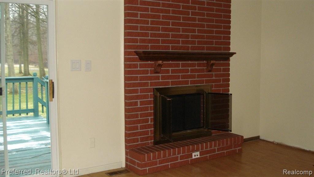 48535 Willow Road Belleville, MI 48111 - Photo 4 of 10 dining room fireplace.JPG