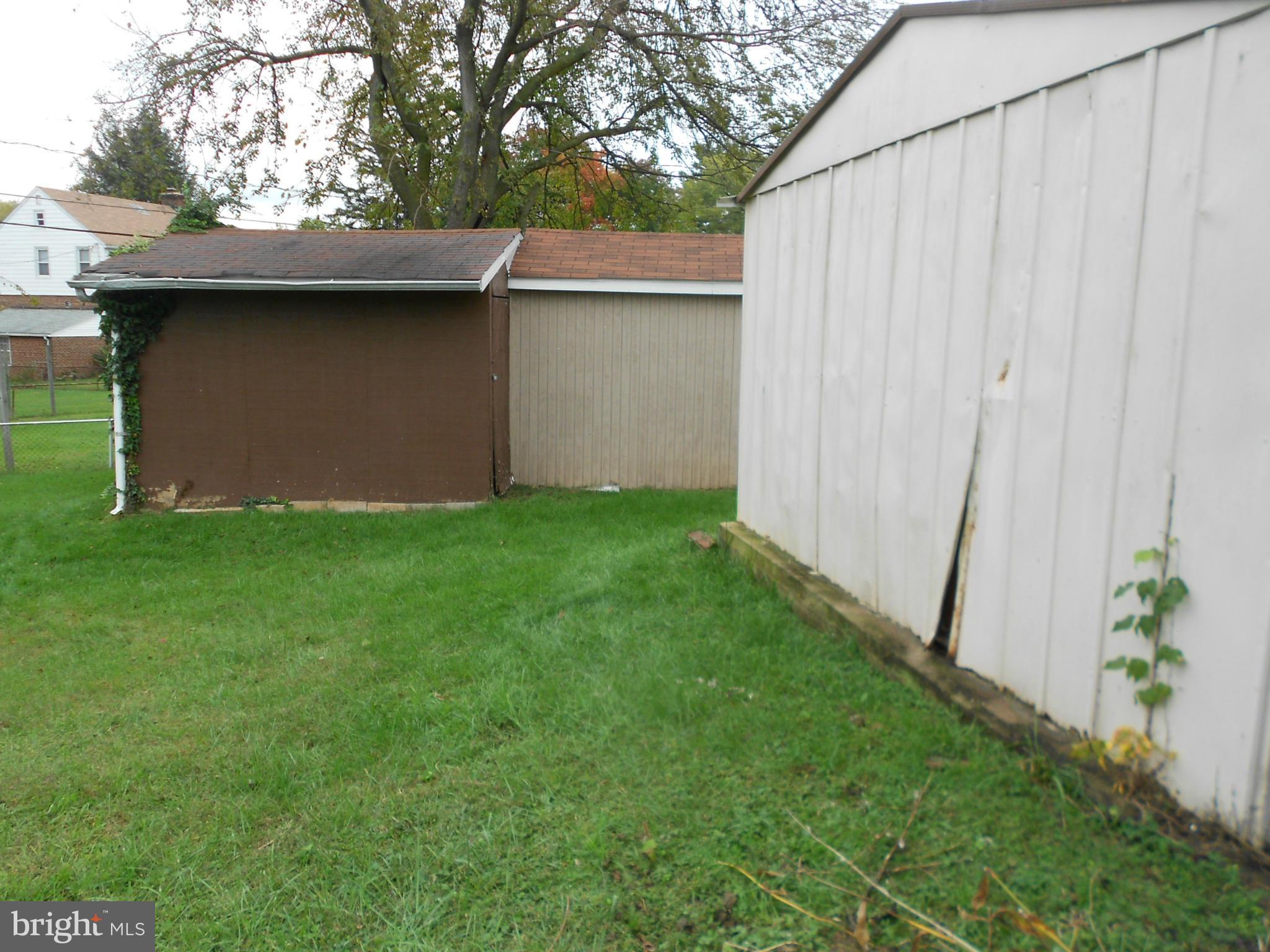 6235 Robin Hill Road Baltimore, MD 21207 - Photo 2 of 30 a view of backyard of house with wooden fence