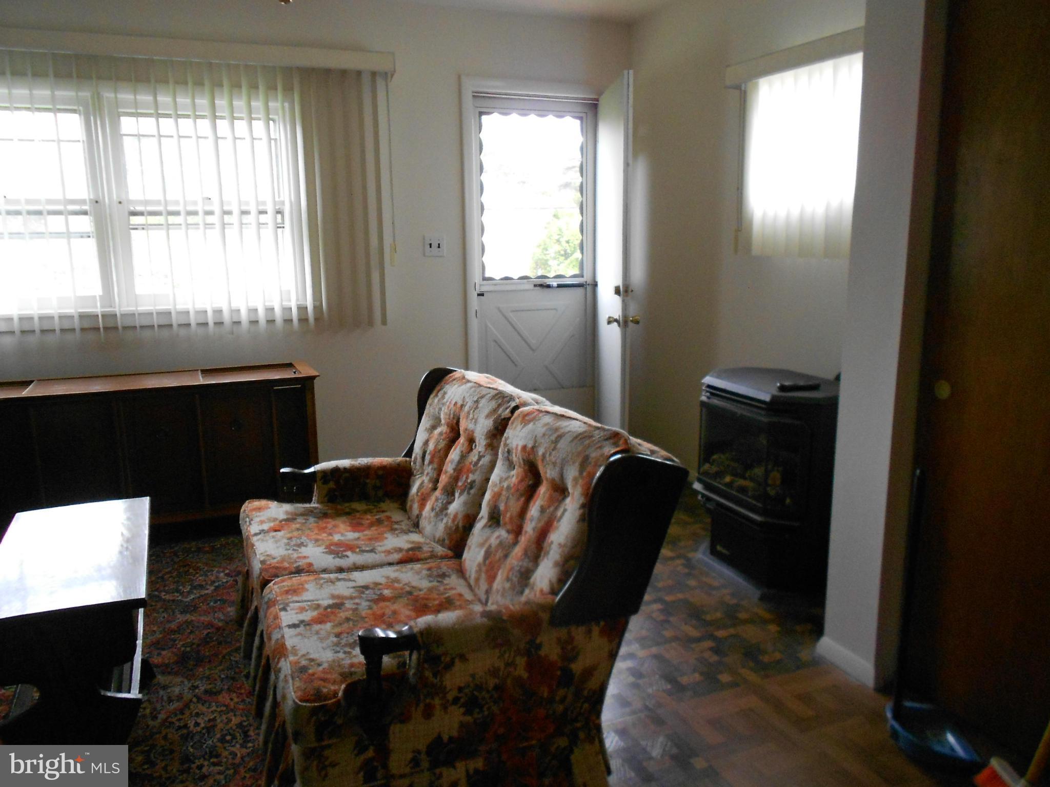 6235 Robin Hill Road Baltimore, MD 21207 - Photo 13 of 30 a bedroom with a bed and a window