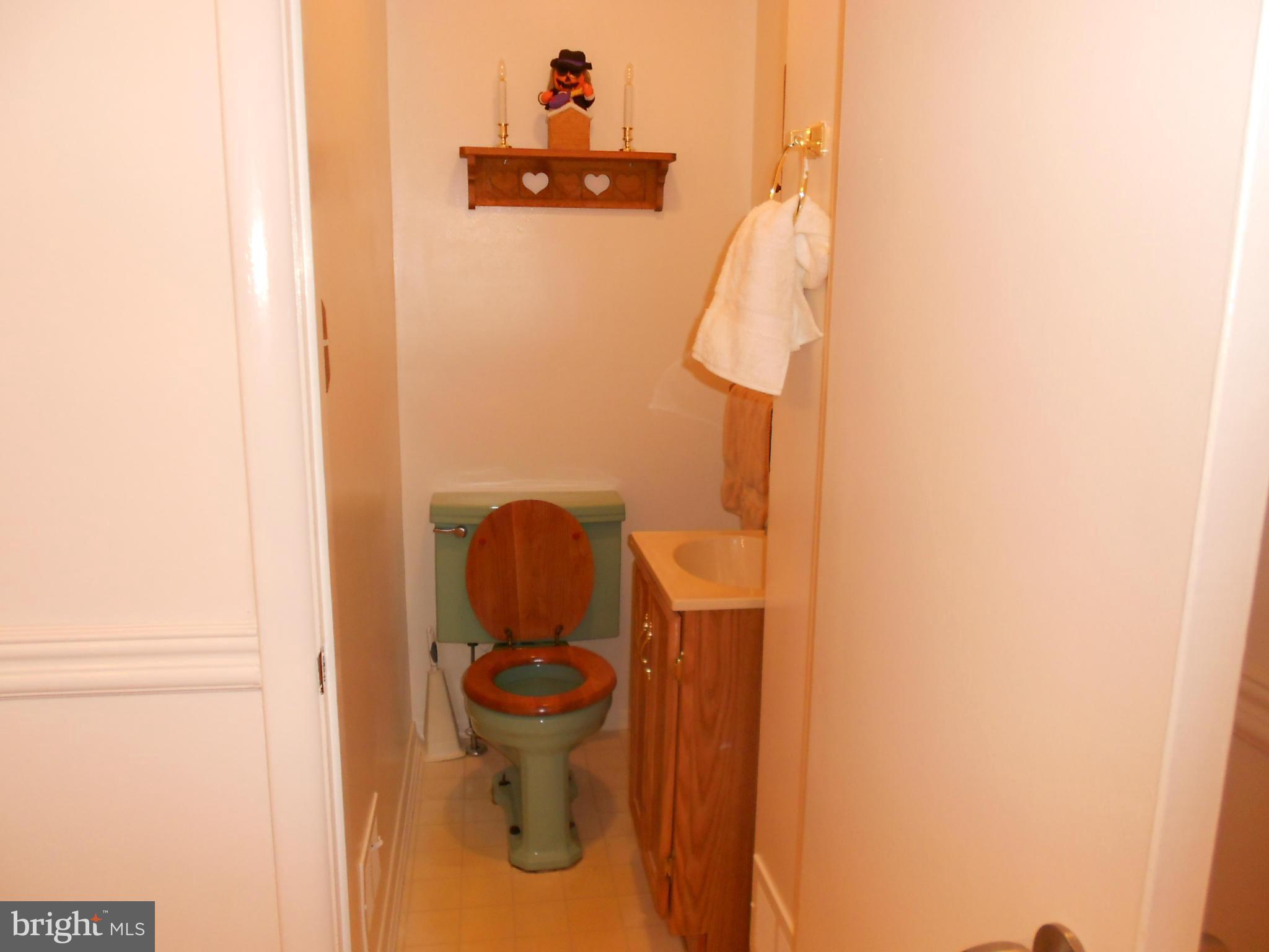 6235 Robin Hill Road Baltimore, MD 21207 - Photo 16 of 30 a bathroom with a toilet and a sink