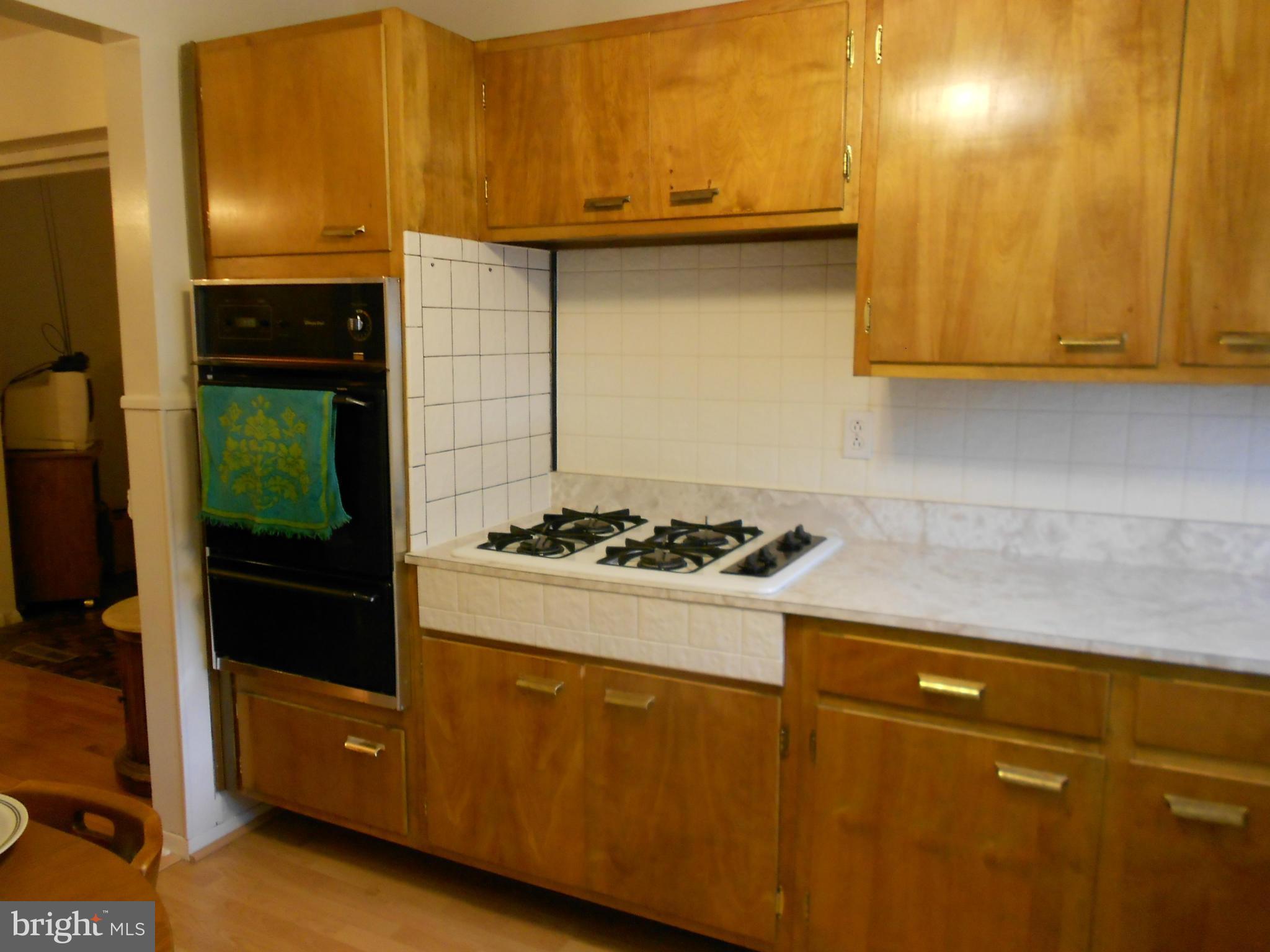 6235 Robin Hill Road Baltimore, MD 21207 - Photo 18 of 30 a kitchen with a stove and a refrigerator