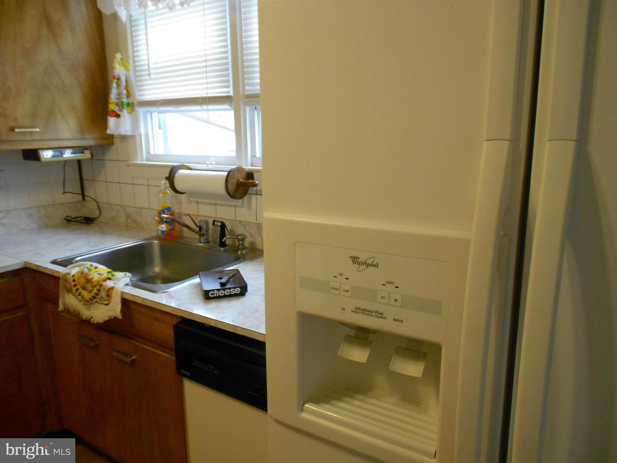 6235 Robin Hill Road Baltimore, MD 21207 - Photo 19 of 30 a bathroom with a sink and a window