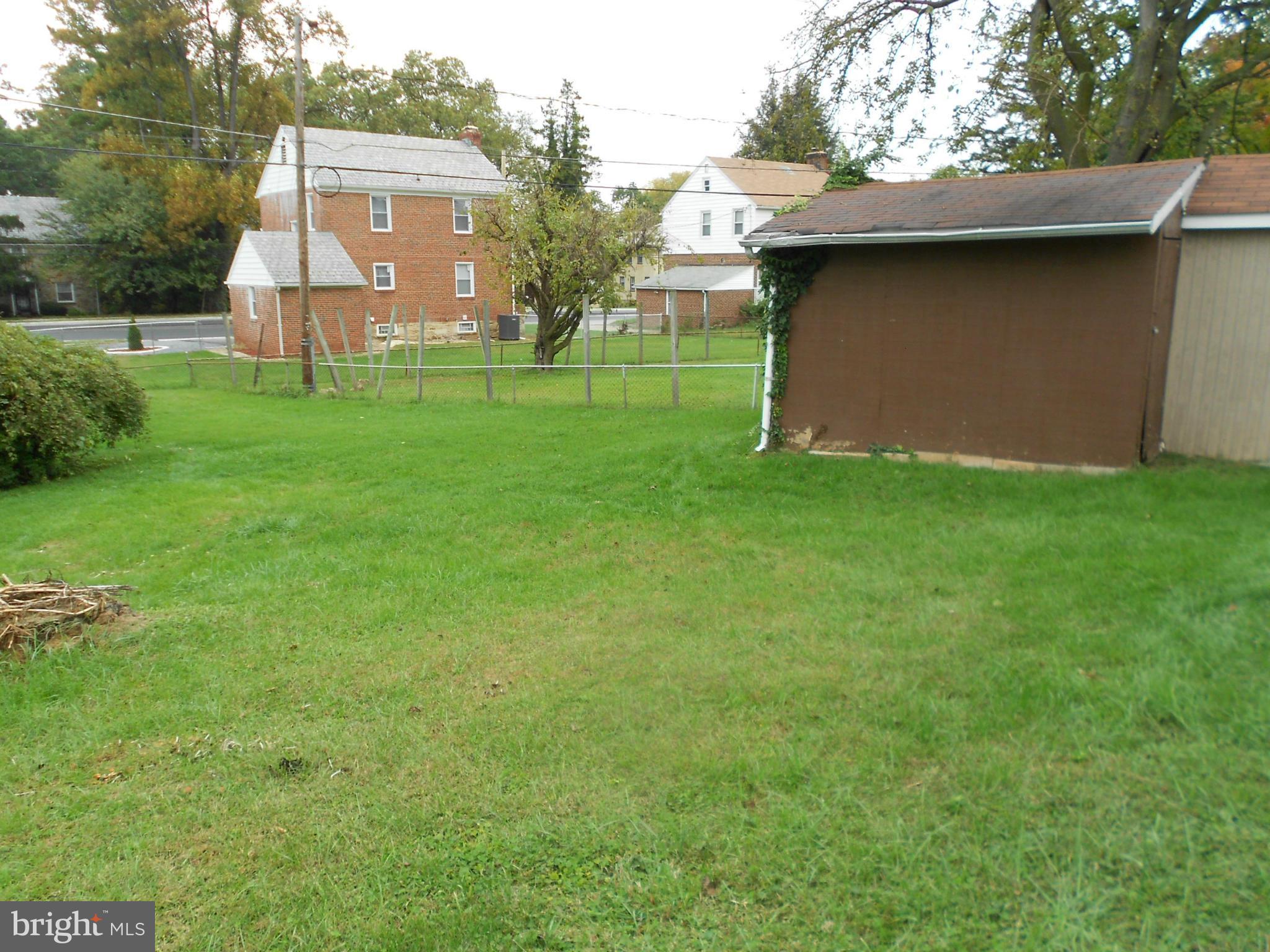 6235 Robin Hill Road Baltimore, MD 21207 - Photo 28 of 30 a view of a backyard with plants and a garden