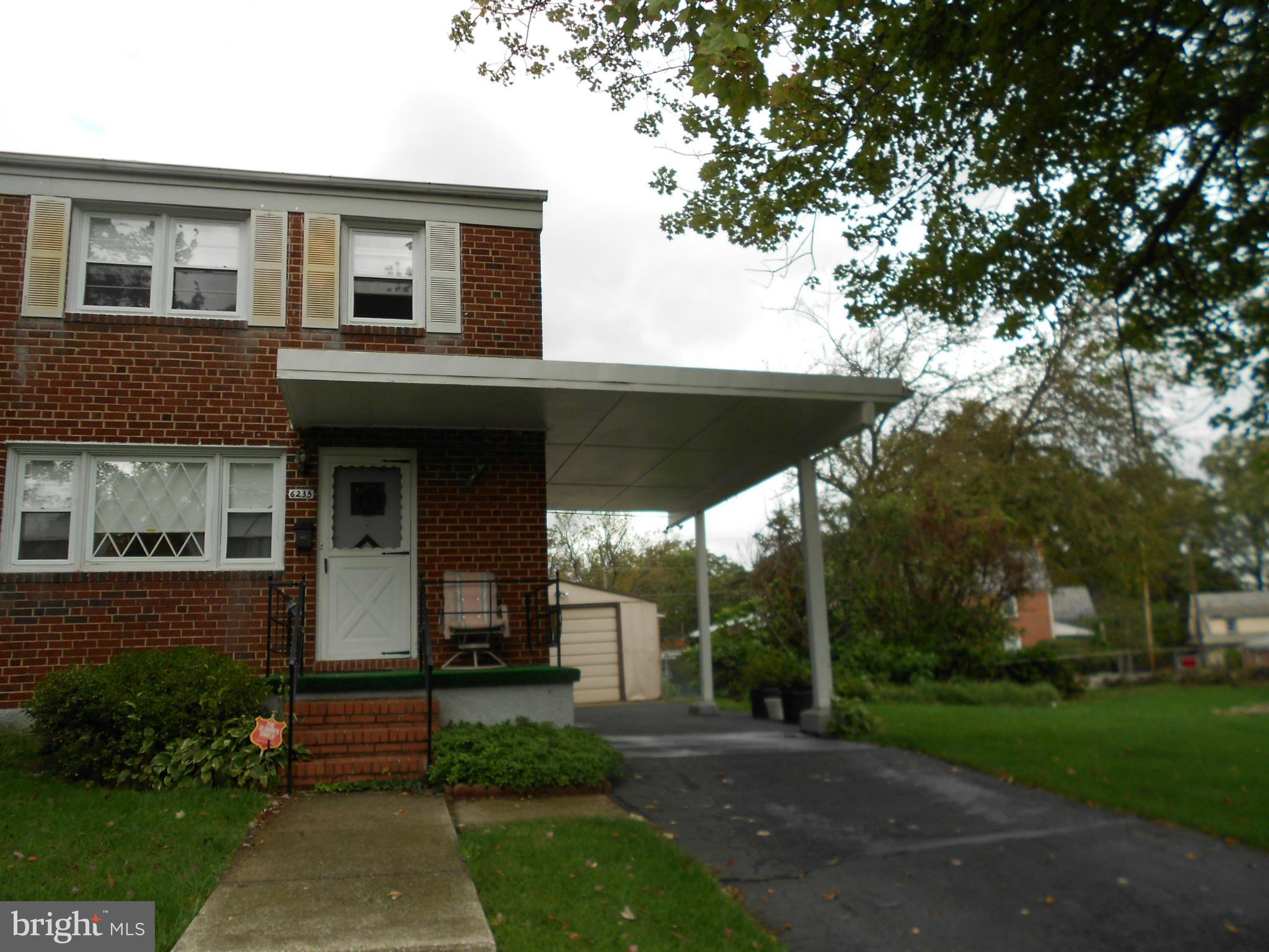 6235 Robin Hill Road Baltimore, MD 21207 - Photo 29 of 30 a front view of a house with garden
