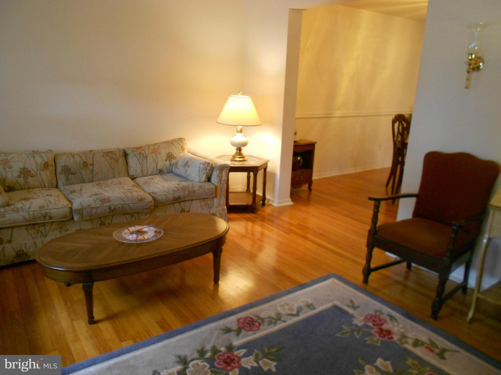 6235 Robin Hill Road Baltimore, MD 21207 - Photo 6 of 30 a living room with furniture and a wooden floor