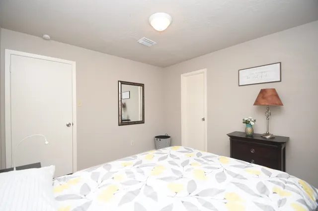 a view of a porch with furniture and floor to ceiling window