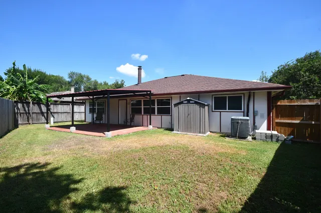 a kitchen with a sink a stove and refrigerator