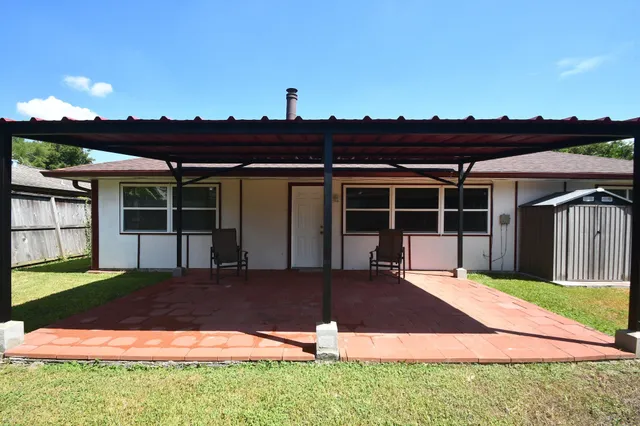 a kitchen with granite countertop wood cabinets and stainless steel appliances