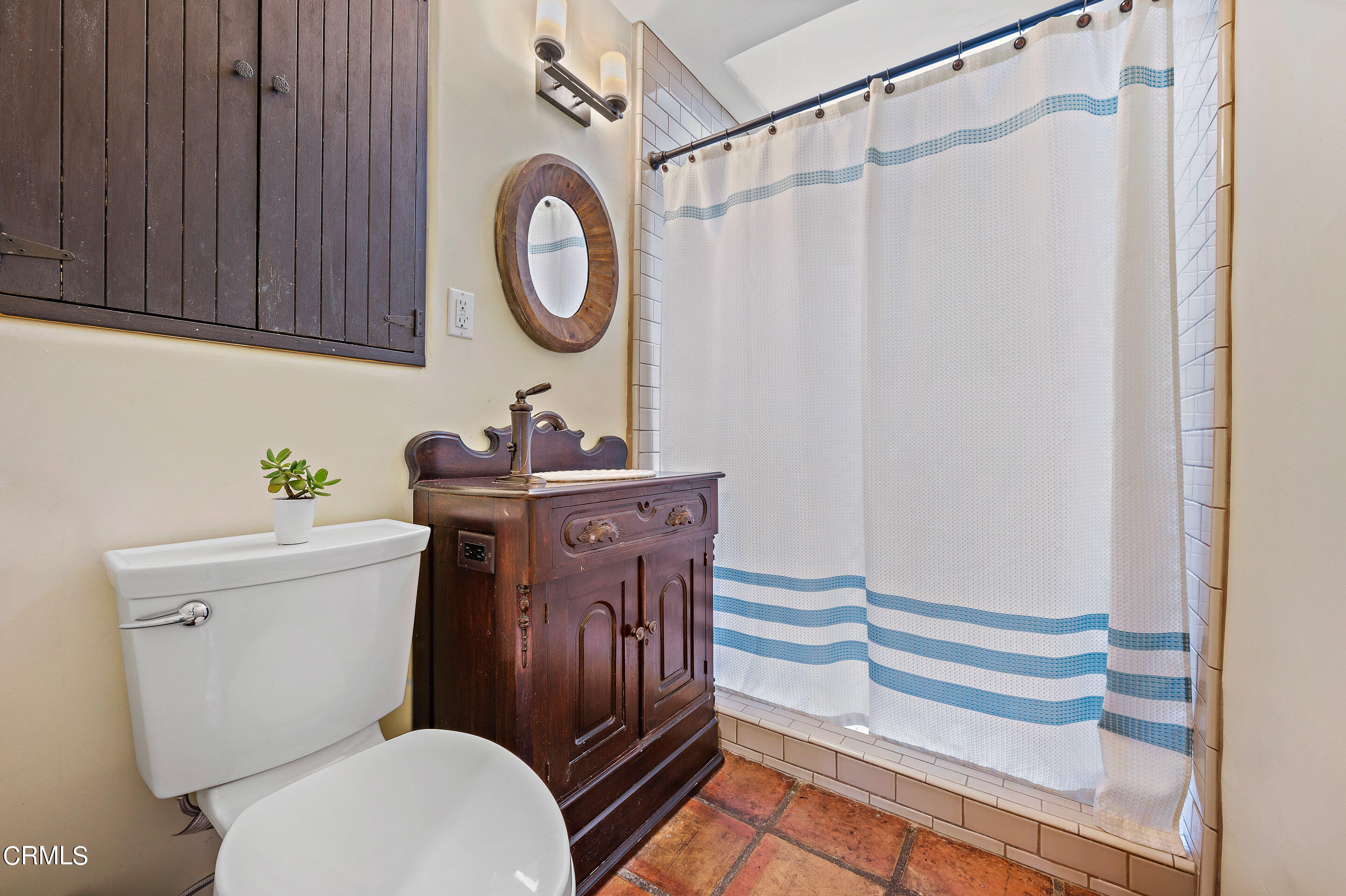 511 Garfield Avenue South Pasadena, CA 91030 - Photo 22 of 46 a bathroom with a toilet a sink and a mirror
