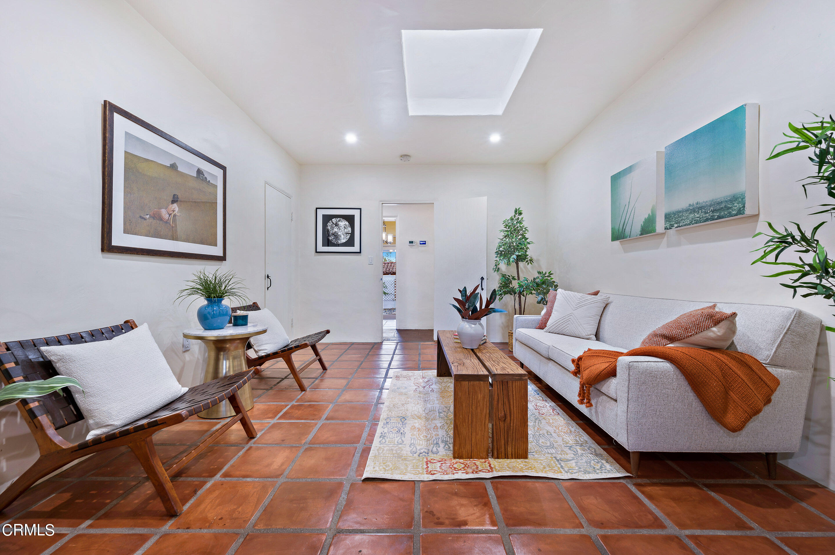 511 Garfield Avenue South Pasadena, CA 91030 - Photo 23 of 46 a living room with furniture a rug and wall paintings