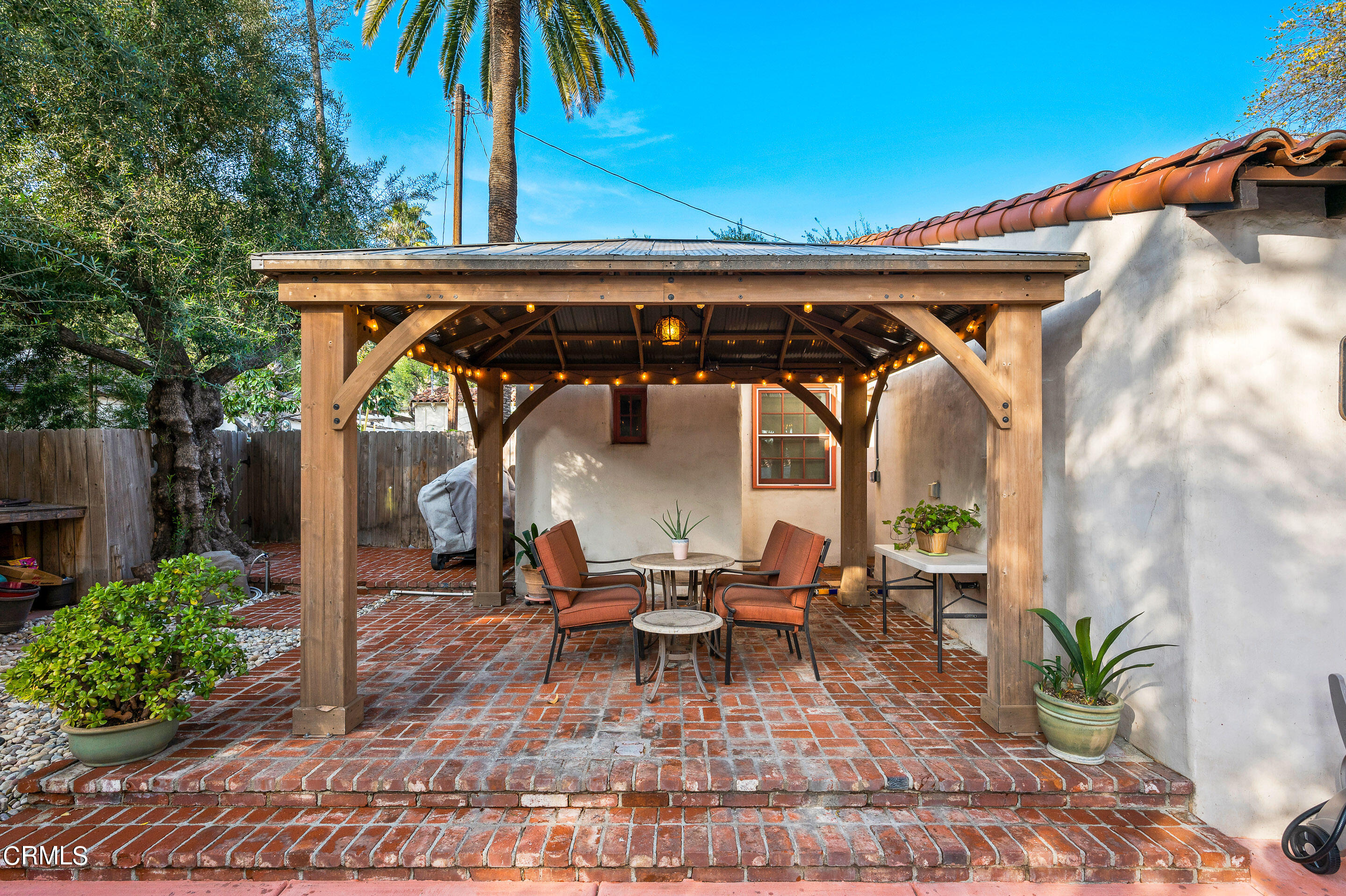 511 Garfield Avenue South Pasadena, CA 91030 - Photo 31 of 46 a view of patio with table and chairs under an umbrella