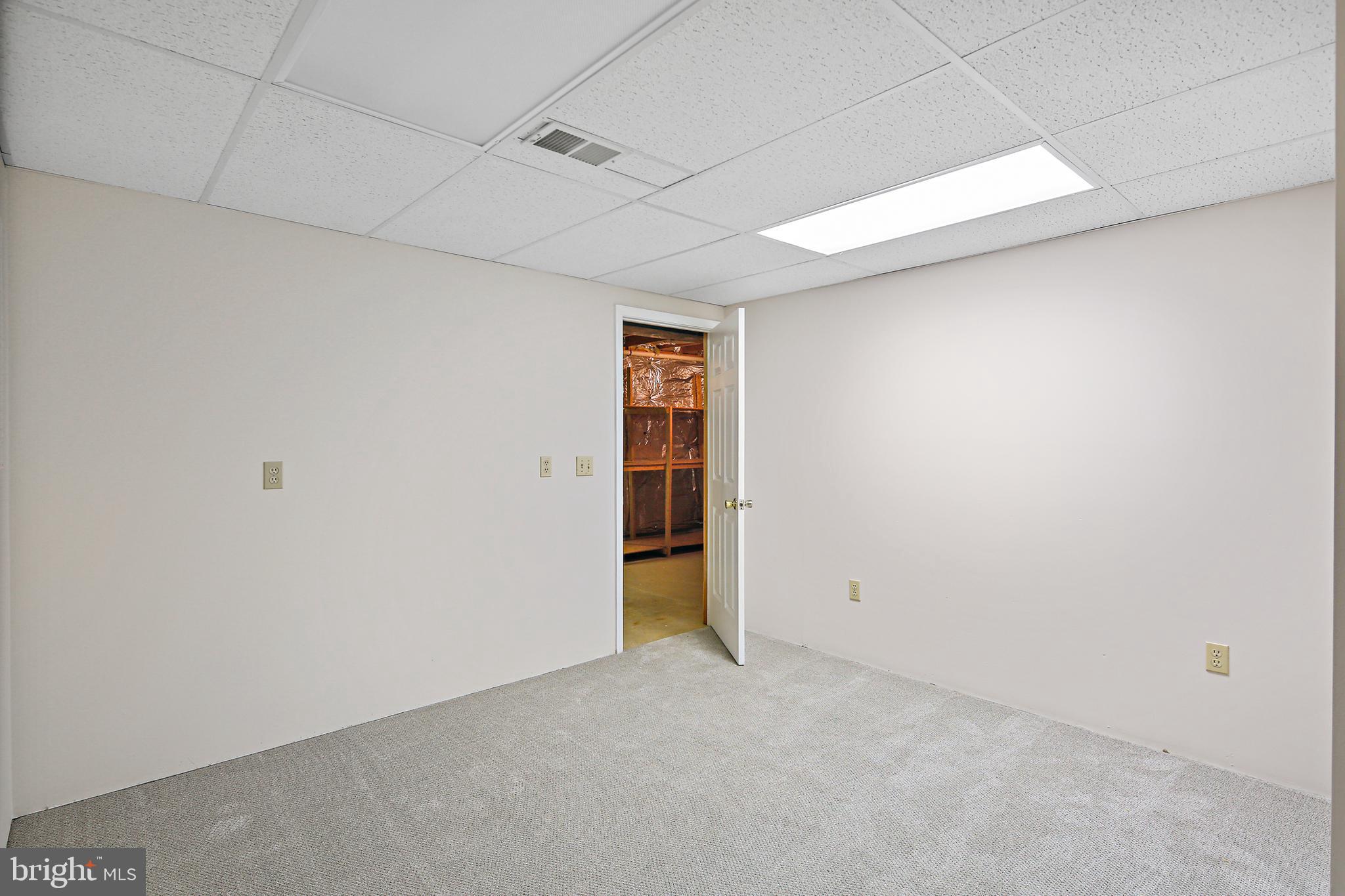 10268 Wetherburn Road Ellicott City, MD 21042 - Photo 35 of 40 Finished Basement w/ bonus rm & storage space
