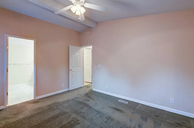 a bathroom with a granite countertop sink mirror and vanity