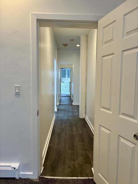 382 Commonwealth Avenue, Unit B1 Boston, MA 02215 - Photo 17 of 22 a view of a hallway with wooden floor