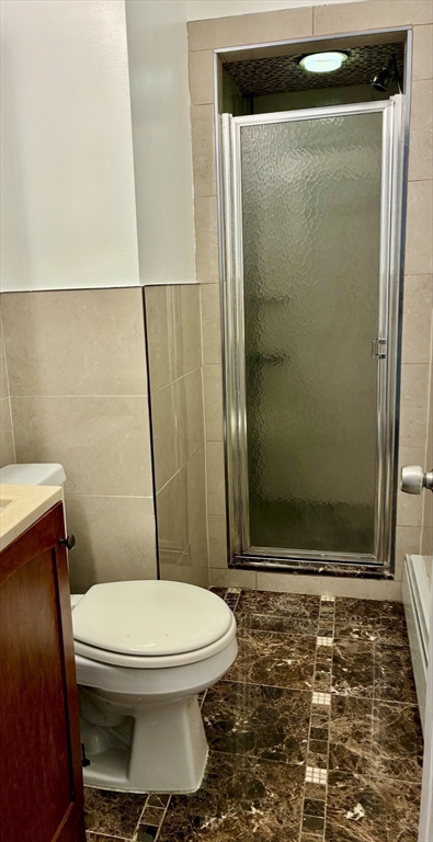 382 Commonwealth Avenue, Unit B1 Boston, MA 02215 - Photo 19 of 22 a bathroom with a toilet and a shower