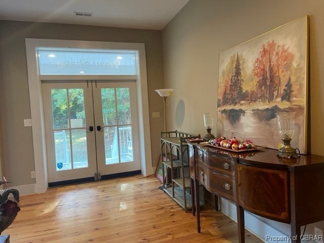 173 Lillys Neck Road Moon, VA 23119 - Photo 4 of 48 Entryway featuring vaulted ceiling, light wood-type flooring, and french doors