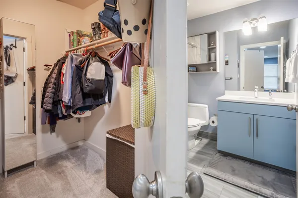 a utility room with cabinets dryer and washer