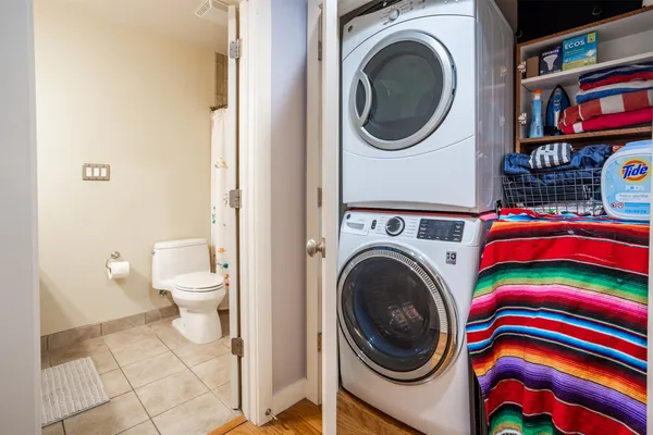 a view of a bedroom with washer and dryer