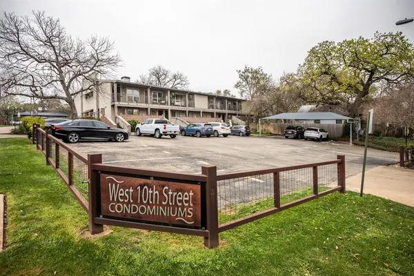 a view of outdoor space with sign board and garden