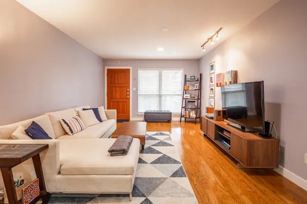 a living room with furniture and a flat screen tv