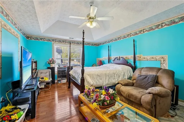 a bedroom with furniture and a chandelier