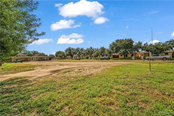 a view of a water fountain and a big yard